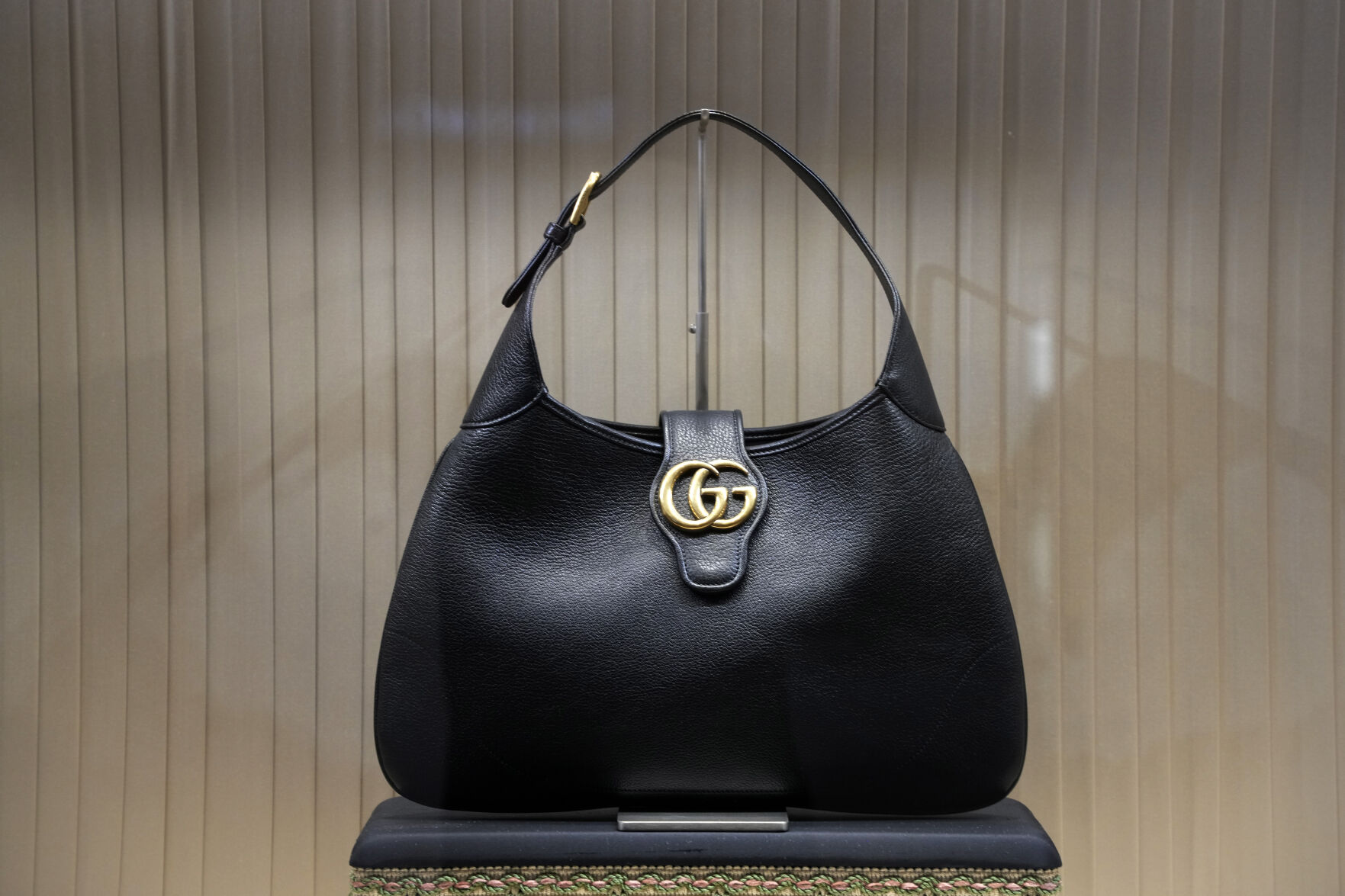 <p>File - A handbag is displayed in the window of a Gucci store in Pittsburgh on Monday, Jan. 30, 2023. On Friday, the Commerce Department issues its February report on consumer spending. (AP Photo/Gene J. Puskar, File)</p>   PHOTO CREDIT: Gene J. Puskar - staff, AP