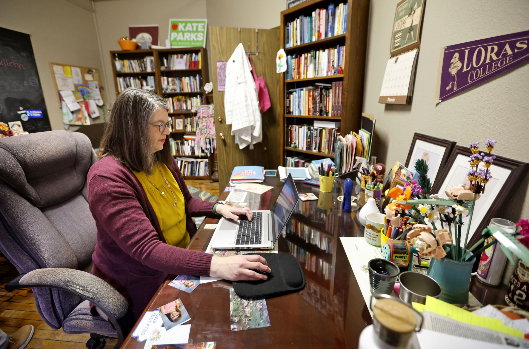 Parks looks over emails at Loras College in Dubuque. Parks is an associate professor of sociology at Loras.    PHOTO CREDIT: Jessica Reilly