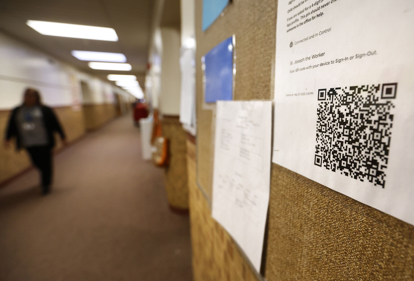 A QR code is displayed on a bulletin board.    PHOTO CREDIT: JESSICA REILLY
Telegraph Herald