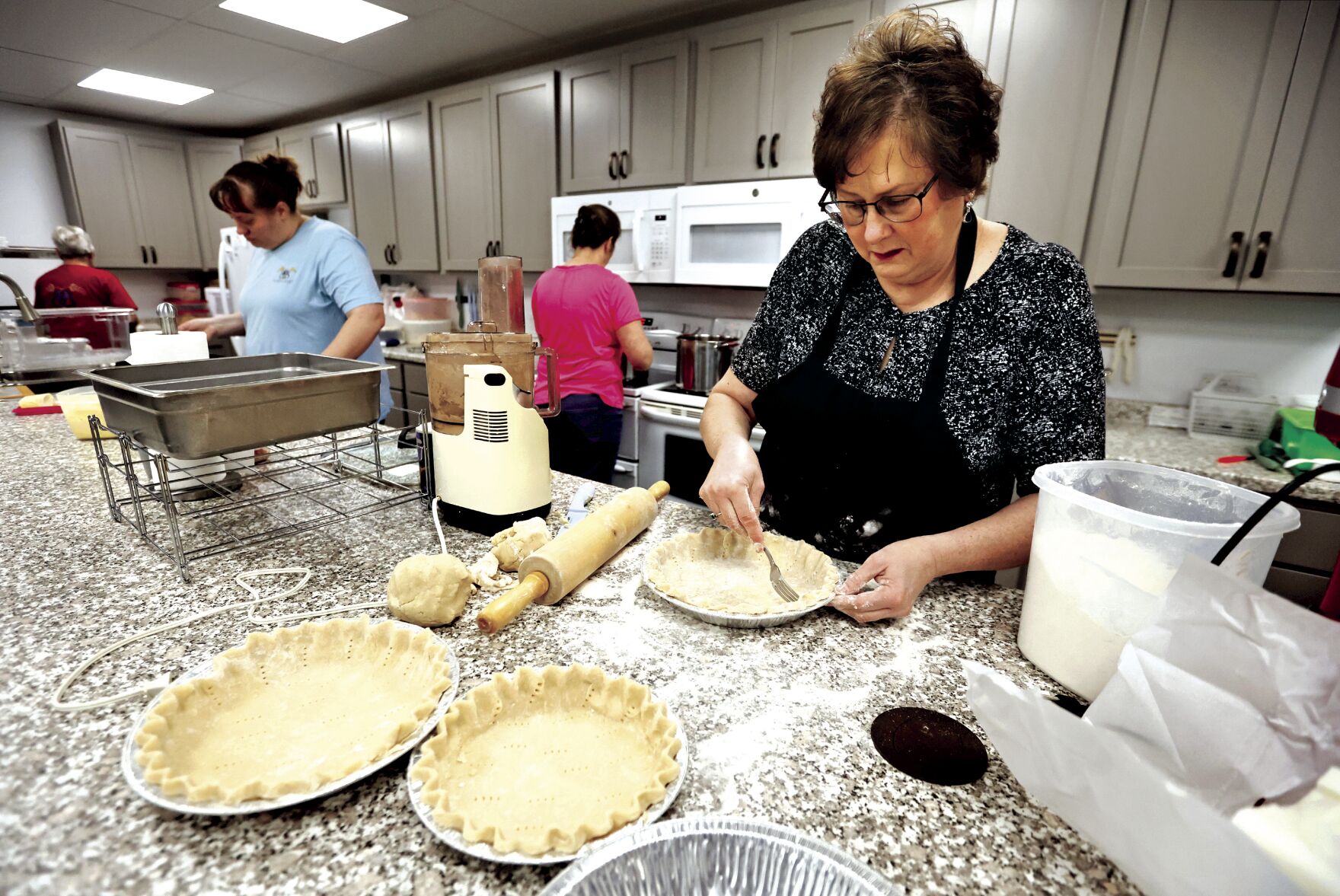 Owner Jackie Mormann makes pie crusts at The Bread Basket in Manchester, Iowa, on Thursday.    PHOTO CREDIT: JESSICA REILLY