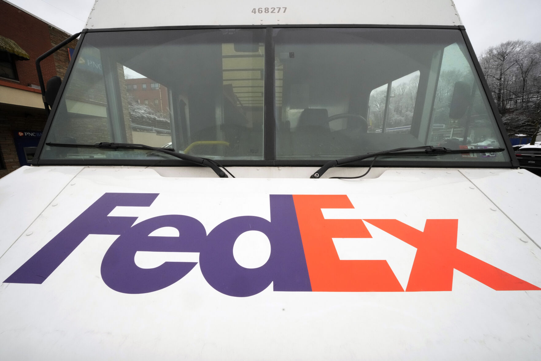 <p>A FedEx truck makes deliveries in Mount Lebanon, Pa., on Monday, Jan. 23, 2023. FedEx will combine its air, ground and other divisions as part of a $4 billion cost cutting plan. The delivery company said Wednesday, April 5, that FedEx Express, FedEx Ground, FedEx Services and other FedEx operating companies will be rolled into Federal Express Corp. by June 2024. (AP Photo/Gene J. Puskar)</p>   PHOTO CREDIT: Gene J. Puskar
