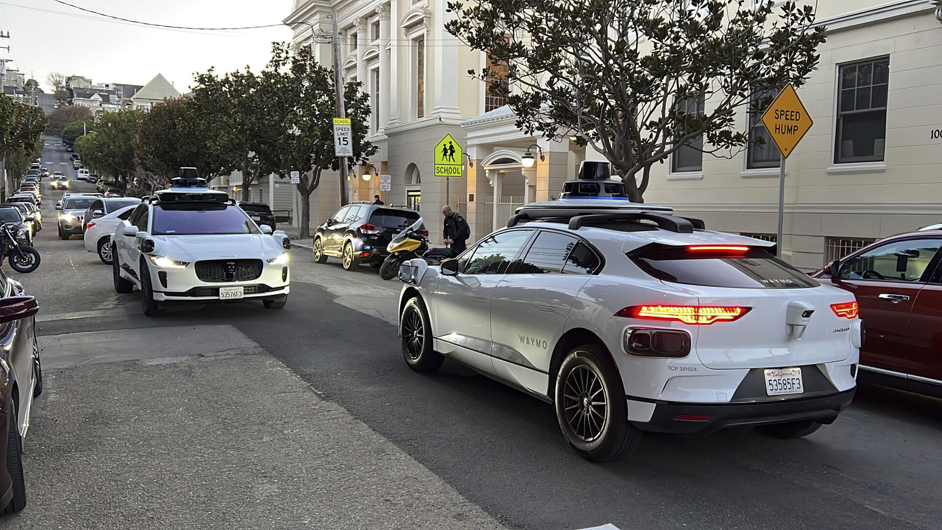 <p>Two Waymo driverless taxis stop and face each other on a street in San Francisco before driving past each other, on Feb. 15, 2023. Cruise, a subsidiary of General Motors, and Waymo, a spinoff from Google, both are on the verge of operating 24-hour services that would transport passengers throughout one of the most densely populated U.S. cities in vehicles that will have no one sitting in the driver’s seat. (AP Photo/Terry Chea)</p>   PHOTO CREDIT: Terry Chea - staff, AP