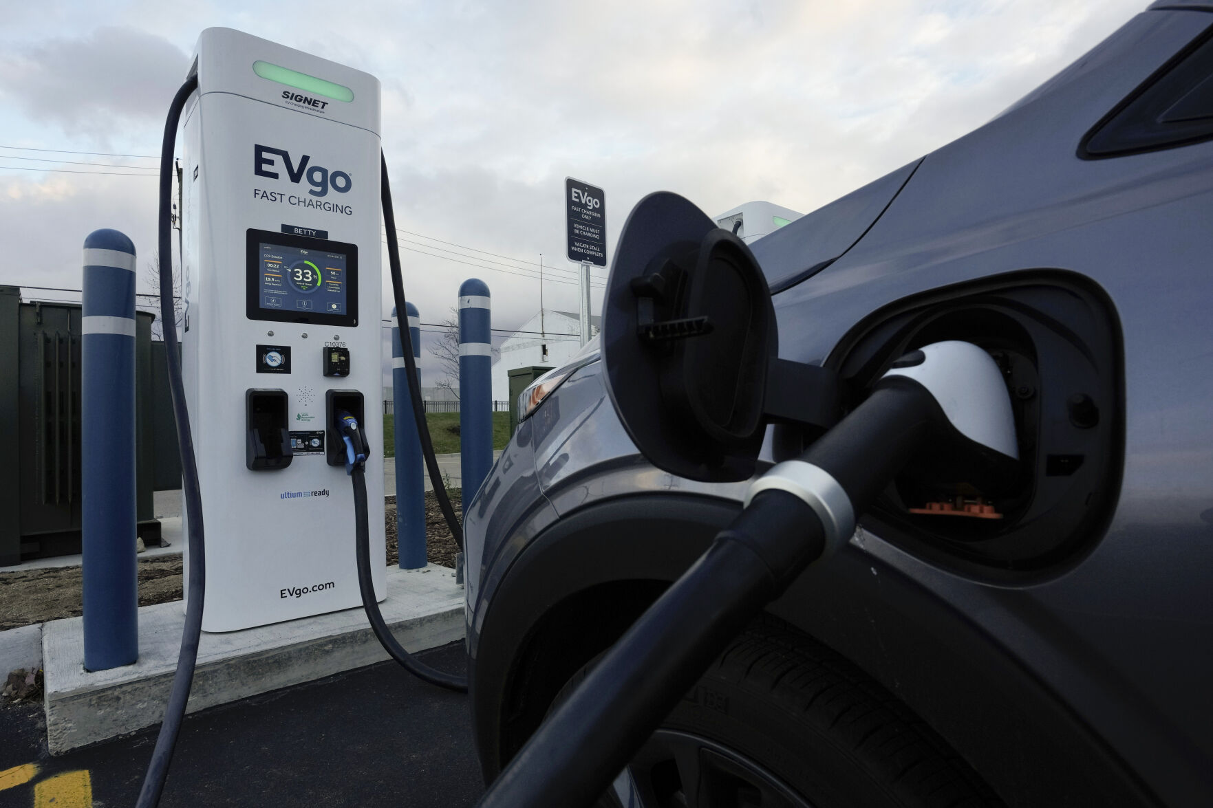 <p>FILE - An electric vehicle charges at an EVgo fast charging station in Detroit on Nov. 16, 2022. The Biden administration is proposing strict new automobile pollution limits that would require as many as two-thirds of new vehicles sold in the U.S. to be electric by 2032 — a nearly tenfold increase over current EV sales, according to an announcement from the Environmental Protection Agency Wednesday, April 12, 2023. (AP Photo/Paul Sancya, File)</p>   PHOTO CREDIT: Paul Sancya 