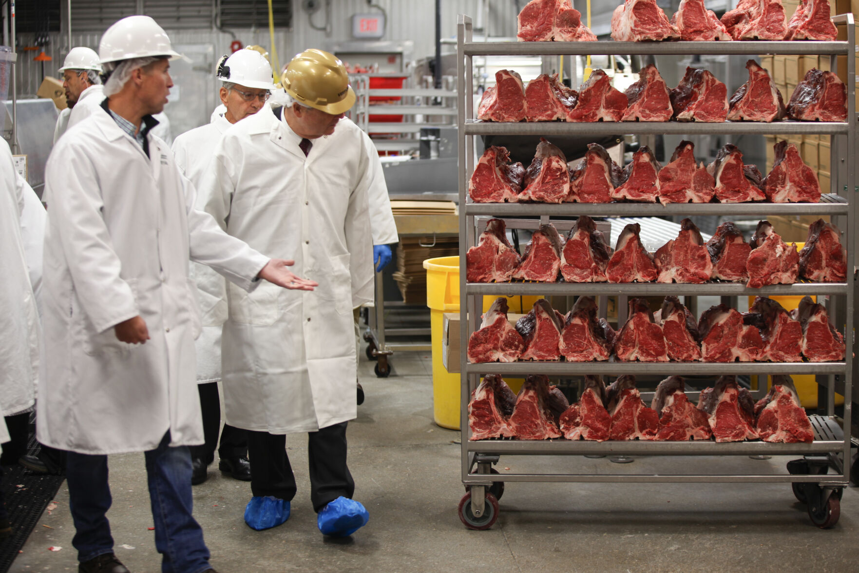 <p>FILE - U.S. Agriculture Secretary Tom Vilsack, center, tours the Greater Omaha Packing beef processing plant in Omaha, Neb., on Nov. 2, 2022. Vilsack sent a letter Wednesday, April 12, 2023, to the 18 largest meat and poultry producers urging them to examine the hiring practices at their companies and suppliers. The letter is part of a broader effort by the Biden administration to crack down on the use of child labor. (AP Photo/Josh Funk, File)</p>   PHOTO CREDIT: Josh Funk 