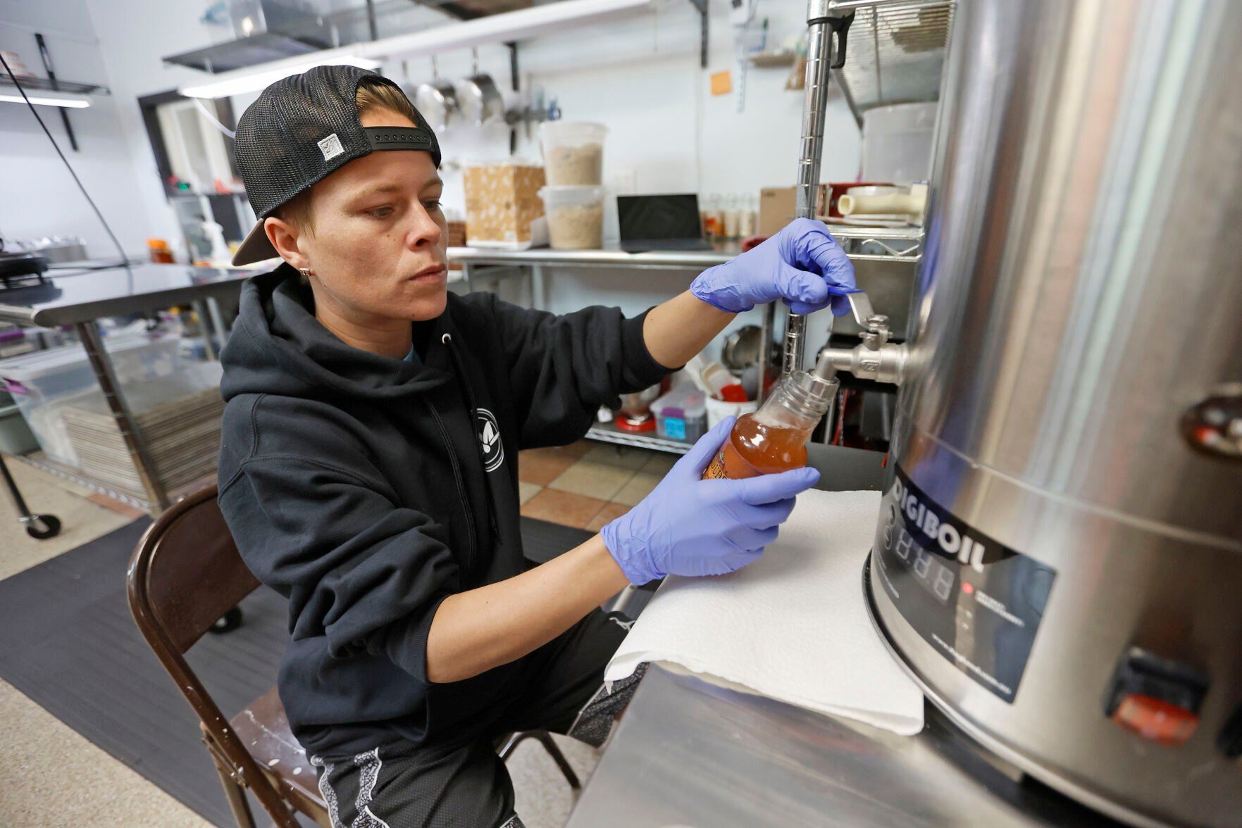 Shawna Dole fills bottles with product at River Bluff Collective in East Dubuque, Ill., on Thursday, April 13, 2023.    PHOTO CREDIT: JESSICA REILLY
Telegraph Herald