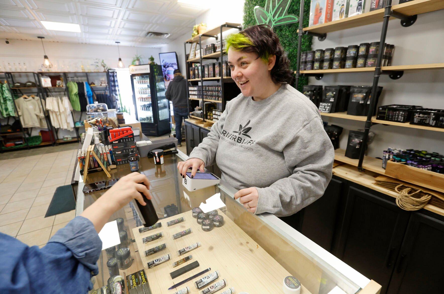 Jasper Allan helps a customer at River Bluff Collective in East Dubuque, Ill. The locally-based cannabis company recently opened its first dispensary in Roselle, Ill.    PHOTO CREDIT: JESSICA REILLY
Telegraph Herald