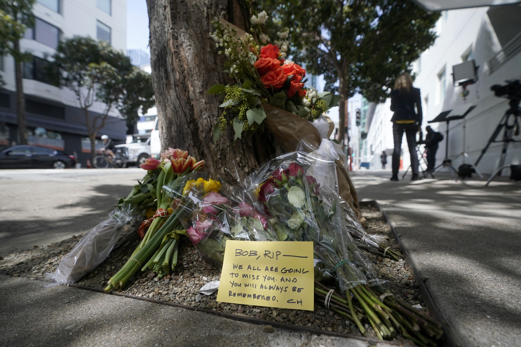 <p>Flowers sit at a tree in front of the building where a technology executive was fatally stabbed outside of in San Francisco, Thursday, April 6, 2023. Details of how tech executive Bob Lee came to be fatally stabbed in downtown San Francisco early Tuesday were scarce as friends and family continued to mourn the man they called brilliant, kind and unlike others in the industry. (AP Photo/Jeff Chiu)</p>   PHOTO CREDIT: Jeff Chiu - staff, AP