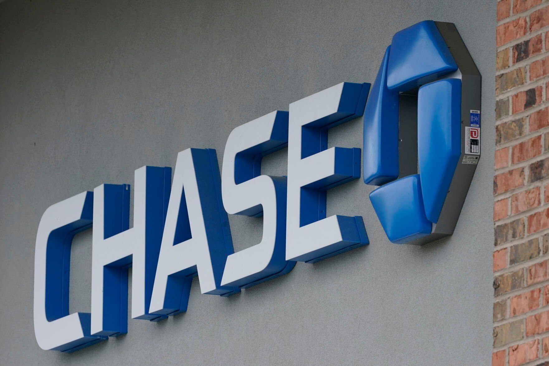 <p>A Chase bank sign in Richmond, Va., Wednesday, June 2, 2021. PMorgan reports earnings on Friday, April 14, 2023. (AP Photo/Steve Helber, File)</p>   PHOTO CREDIT: Steve Helber - staff, AP