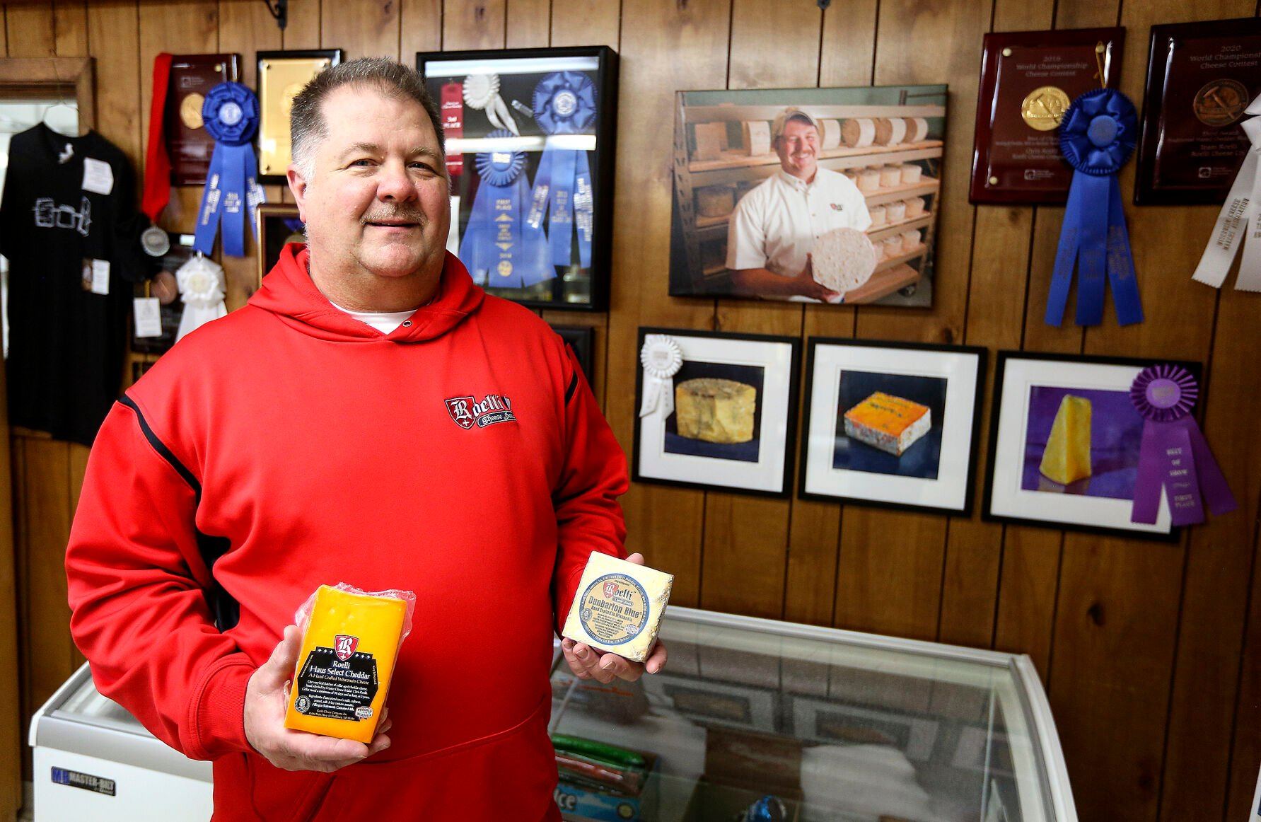 Cheese Master Chris Roelli, who operates Roelli Cheese Haus in Shullsburg, Wis., shows off his award-winning cheeses.    PHOTO CREDIT: Dave Kettering
Telegraph Herald