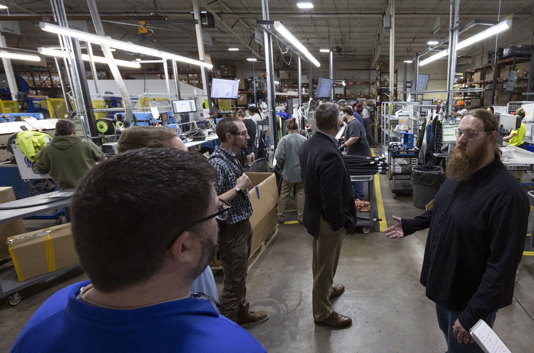 Industrial Automation Engineering Manager Justin Hager (right) leads a tour at ProPulse in Peosta, Iowa, as part of Manufacturing Appreciation Week hosted by Dubuque Area Chamber of Commerce on Tuesday, May 2, 2023.    PHOTO CREDIT: Stephen Gassman