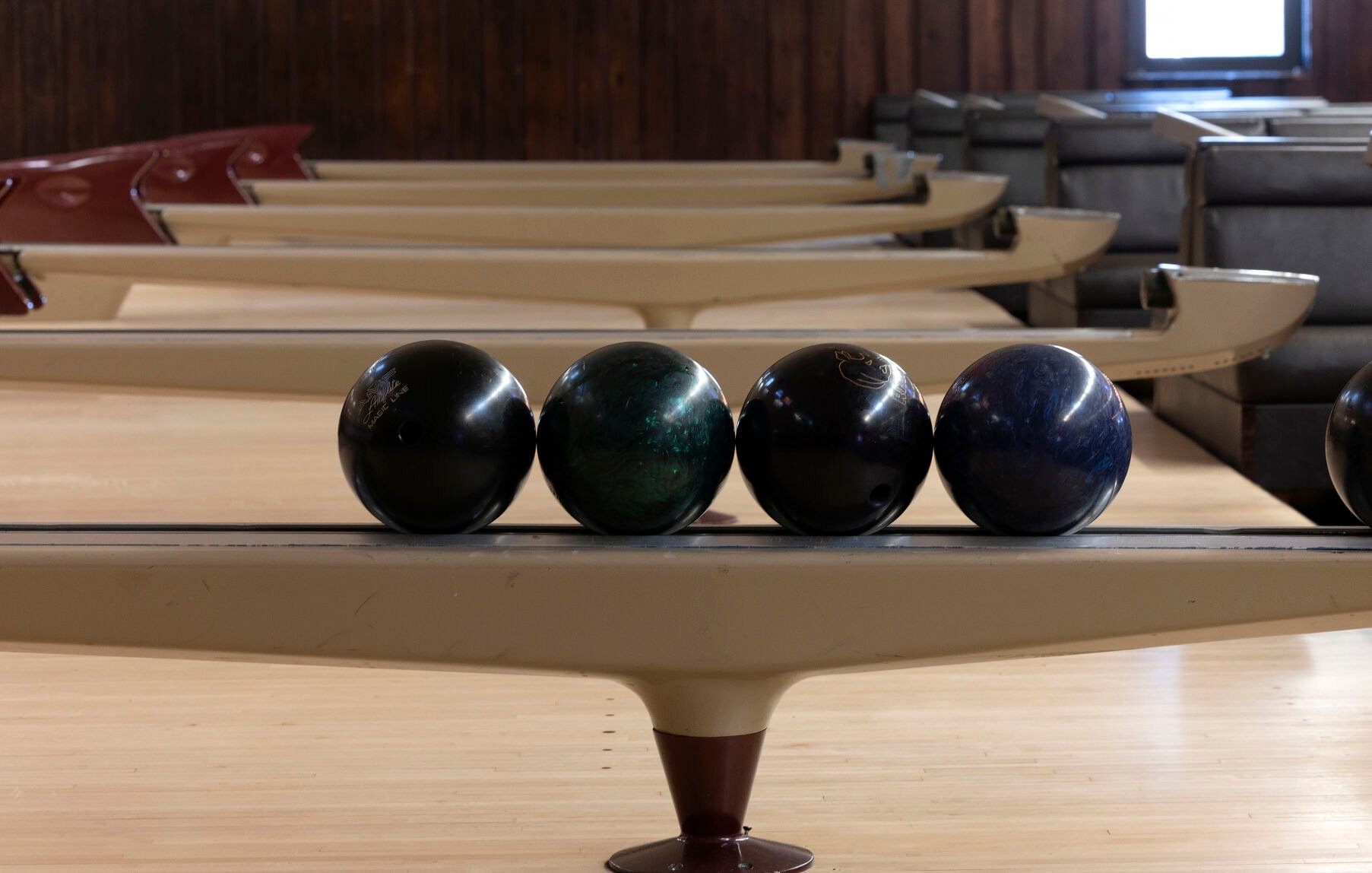 Bowling balls sit on a ball return at Fischer Lanes in Dubuque on Thursday, May 4, 2023.    PHOTO CREDIT: Stephen Gassman
Telegraph Herald