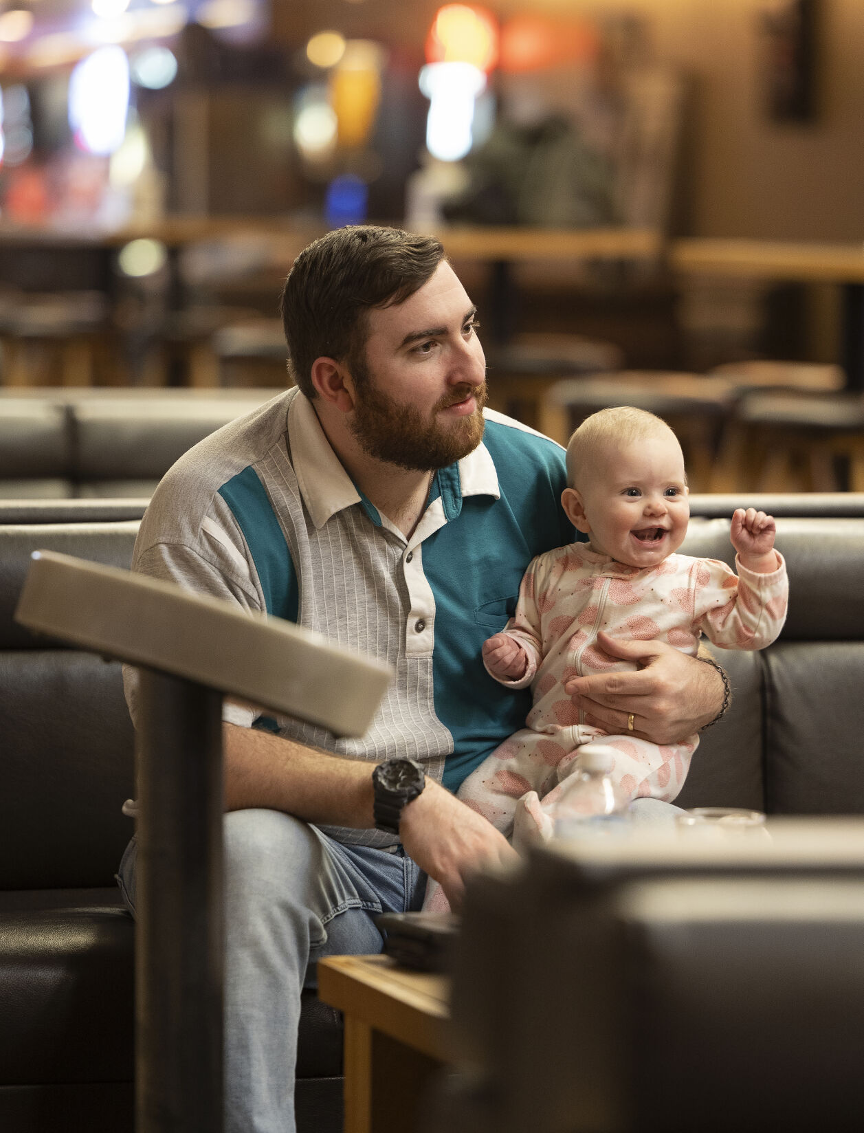 Jonny Carlson holds daughter Gianna, 7 months, during an evening of bowling at Fischer Lanes in Dubuque on Thursday, May 4, 2023.    PHOTO CREDIT: Stephen Gassman
Telegraph Herald