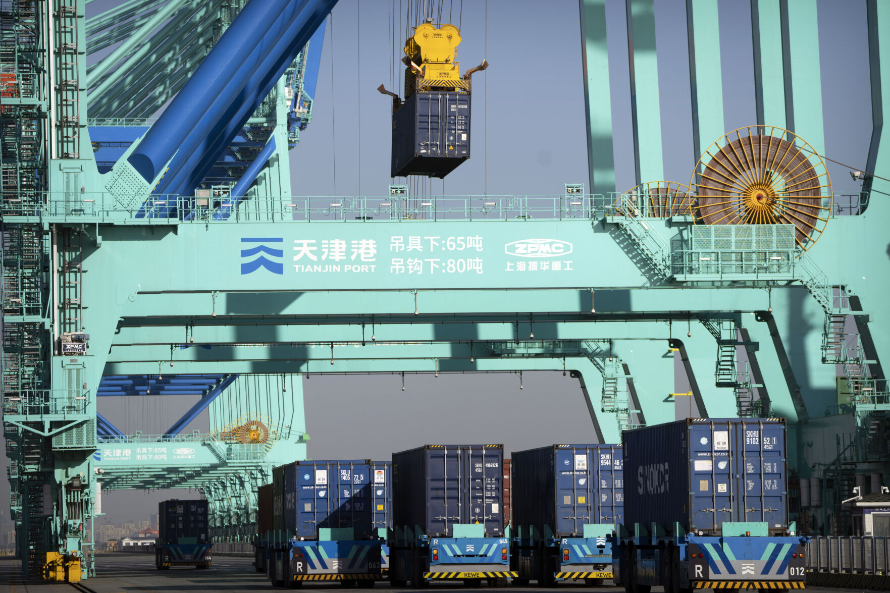 <p>Driverless trucks move shipping containers at a port in Tianjin, China, Monday, Jan. 16, 2023. Chinese exports grew in April by 8.5% to $295.4 billion compared with a year earlier despite weakening global demand. (AP Photo/Mark Schiefelbein)</p>   PHOTO CREDIT: Mark Schiefelbein 