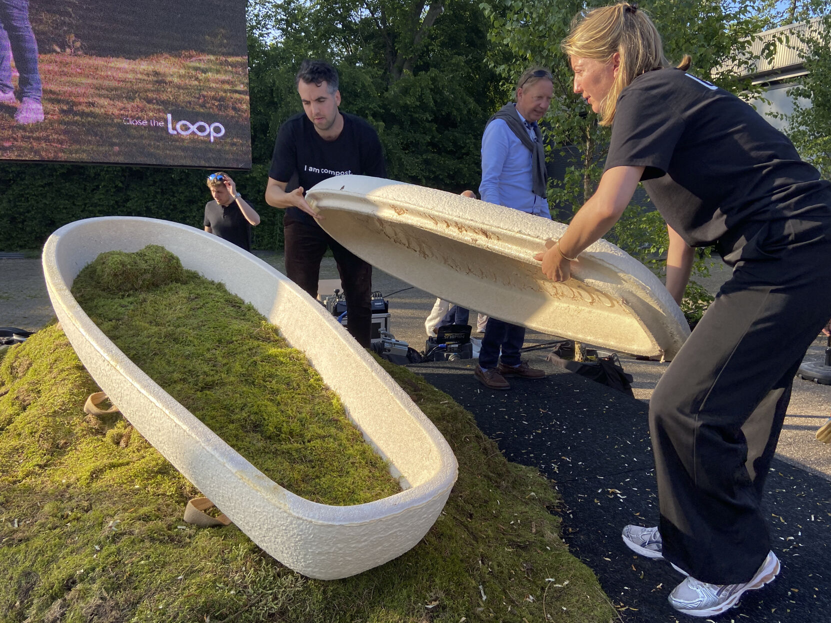 <p>Director Lonneke Westhoff, right, and founder Bob Hendrikx, left, of Dutch startup Loop Biotech display one of the cocoon-like coffins, grown from local mushrooms and up-cycled hemp fibres, designed to dissolve into the environment amid growing demand for more sustainable burial practices, in Delft, Netherlands, Monday, May 22, 2023. A Dutch intrepid inventor is now “growing” coffins by putting mycelium, the root structure of mushrooms, together with hemp fiber in a special mold that, in a week, turns into what could basically be compared to the looks of an unpainted Egyptian sarcophagus. (AP Photo/Aleksandar Furtula)</p>   PHOTO CREDIT: Aleksandar Furtula 