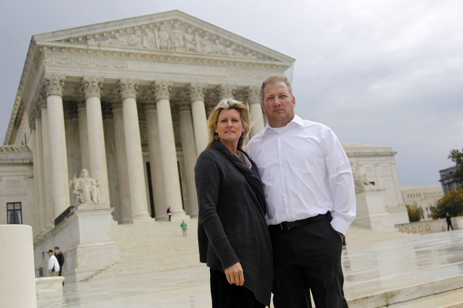 <p>FILE - Michael and Chantell Sackett of Priest Lake, Idaho, pose for a photo in front of the Supreme Court in Washington on Oct. 14, 2011. The Supreme Court on Thursday, May 25, 2023, made it harder for the federal government to police water pollution in a decision that strips protections from wetlands that are isolated from larger bodies of water. The justices boosted property rights over concerns about clean water in a ruling in favor of an Idaho couple who sought to build a house near Priest Lake in the state’s panhandle. (AP Photo/Haraz N. Ghanbari, File)</p>   PHOTO CREDIT: Haraz N. Ghanbari 