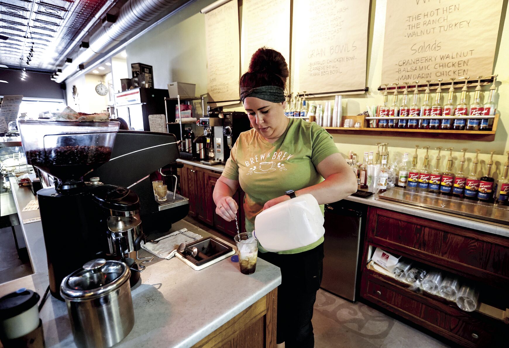 Owner Becca Miller makes a drink at Brew & Brew in Dyersville, Iowa, on Friday.    PHOTO CREDIT: JESSICA REILLY