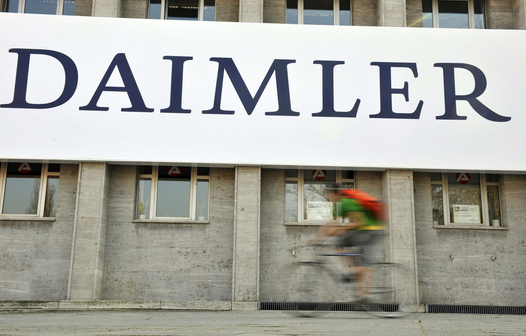 <p>FILE - A cyclist passes a logo of German car company Daimler in Berlin on April 8, 2009. German truck maker Daimler, Japan’s top automaker Toyota and two other automakers said Tuesday, May 30, 2023, they will work together on new technologies, including use of hydrogen fuel, to help fight climate change. (AP Photo/Gero Breloer, File)</p>   PHOTO CREDIT: Gero Breloer 