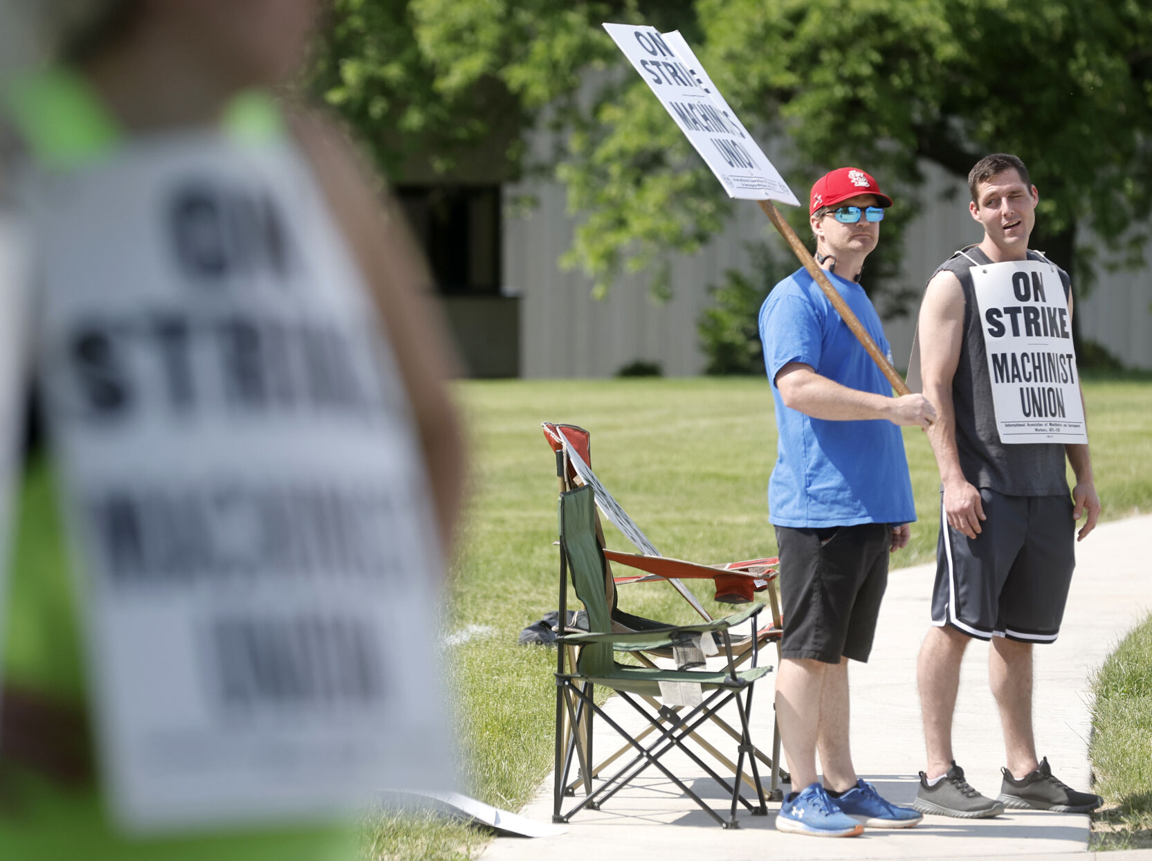 Andrew Winders (left) and Scott Rumple, both employees at A.Y. McDonald Mfg. Co., picket outside the facility on Chavenelle Road in Dubuque on Thursday, June 1, 2023.    PHOTO CREDIT: JESSICA REILLY