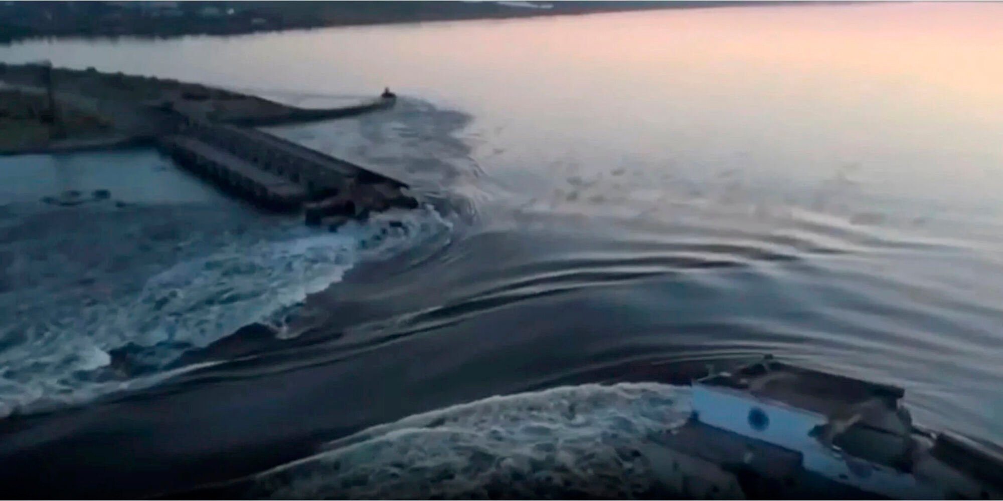 <p>In this image taken from video released by the Ukrainian Presidential Office, water runs through a breakthrough in the Kakhovka dam in Kakhovka, Ukraine, Tuesday, June 6, 2023. Ukraine on Tuesday accused Russian forces of blowing up the major dam and hydroelectric power station in a part of southern Ukraine they control, threatening a massive flood that could displace hundreds of thousands of people, and ordered residents downriver to evacuate. (Ukrainian Presidential Office via AP)</p>   PHOTO CREDIT: Ukrainian Presidential Office