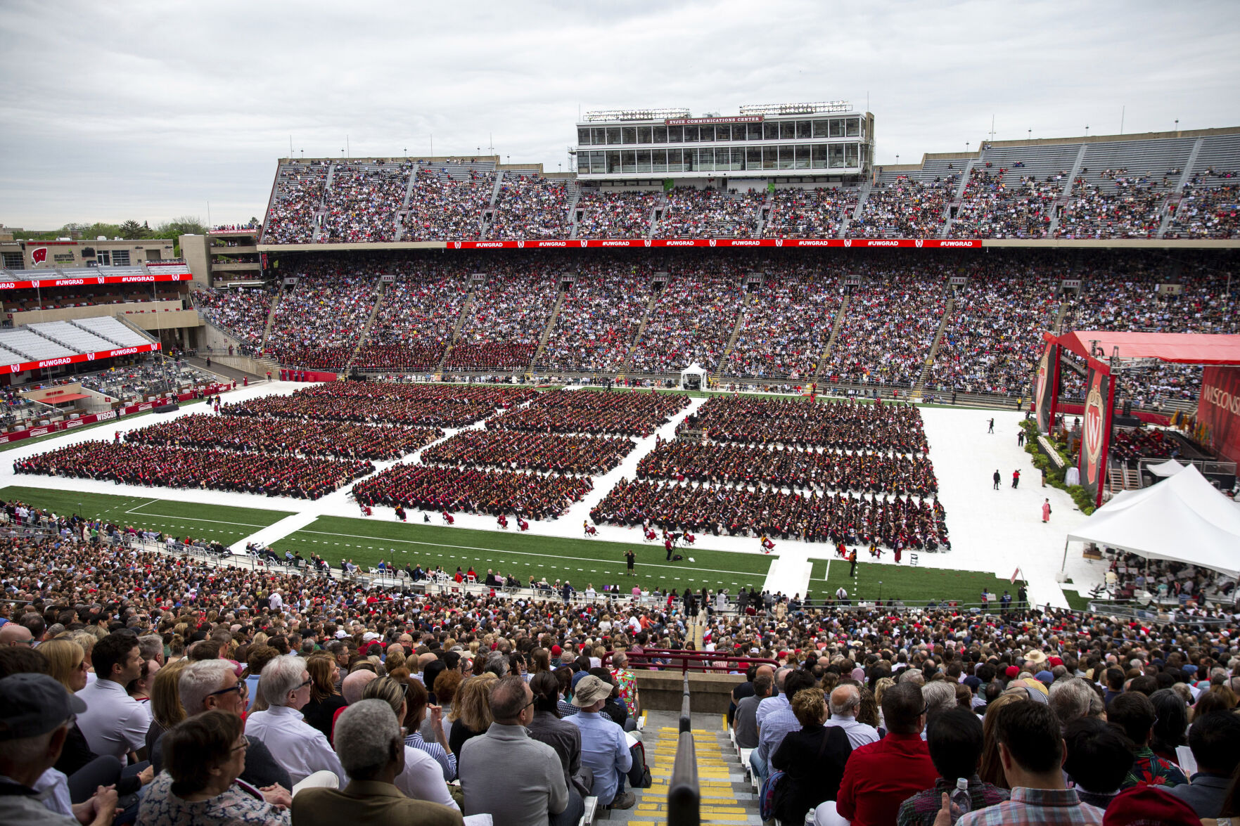 <p>FILE - Attendees watch the 170th University of Wisconsin-Madison commencement ceremony at Camp Randall Stadium in Madison, Wis., on May 13, 2023. Republican lawmakers were poised Tuesday, June 13, to cut funding for University of Wisconsin campuses as the GOP-controlled state Legislature and school officials continue to clash over efforts to promote diversity and inclusion. (Samantha Madar/Wisconsin State Journal via AP, File)</p>   PHOTO CREDIT: SAMANTHA MADAR