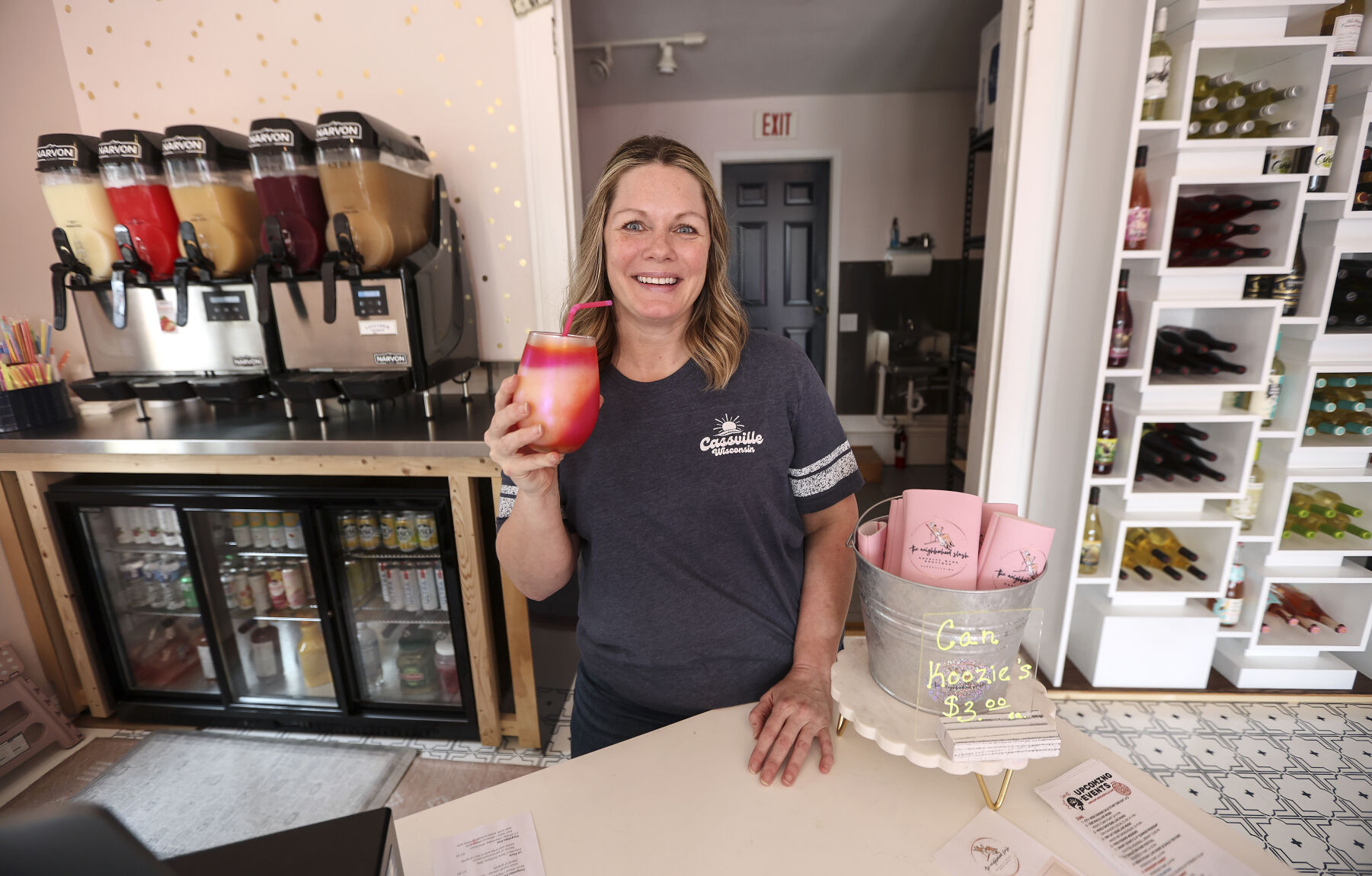 Owner of The Neighborhood Slush Carrie Wunderlin holds one of her wine slush drinks at her business located in Cassville, Wis., on Thursday, June 15, 2023.    PHOTO CREDIT: Dave Kettering