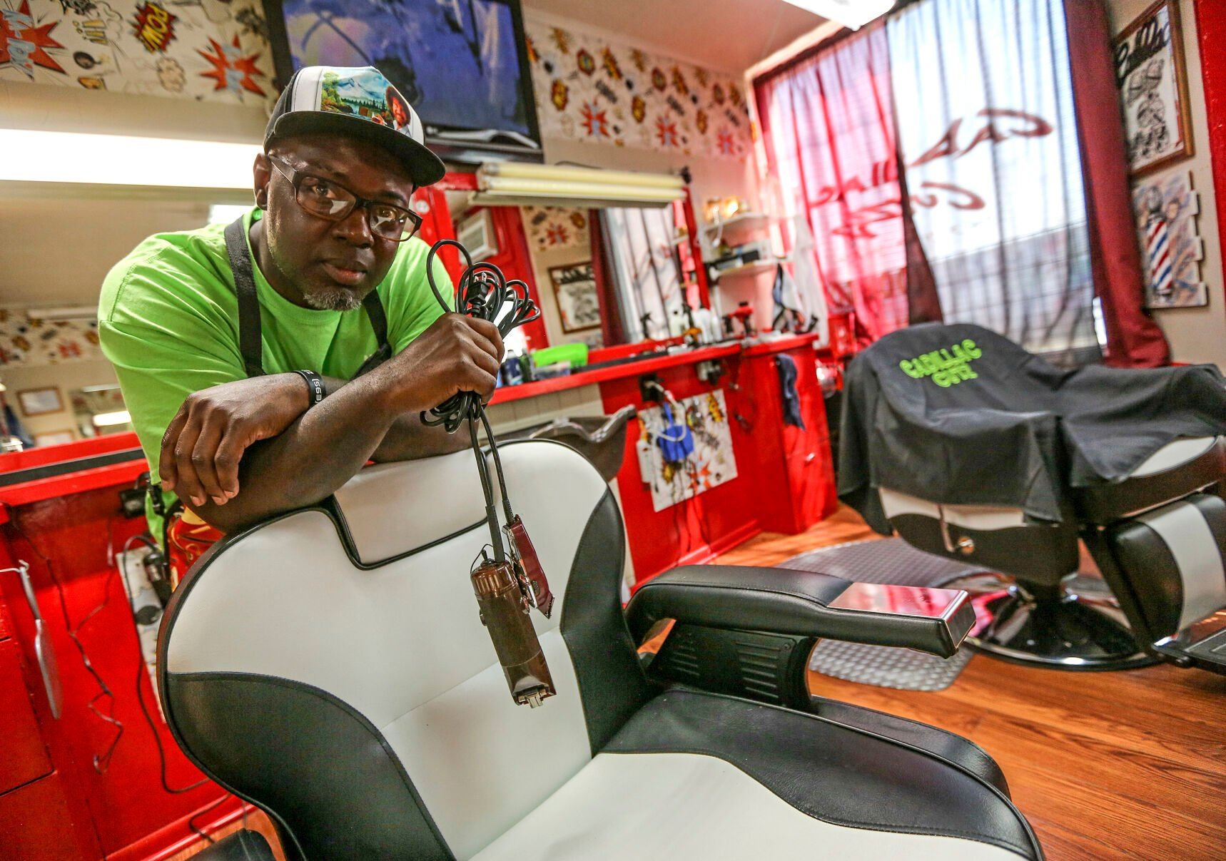 Makiah Cooper, owner of Cadillac Cutz on Elm Street in Dubuque, has been in business for 25 years and has seen the demand for local barbershops in the area grow.    PHOTO CREDIT: Dave Kettering
Telegraph Herald