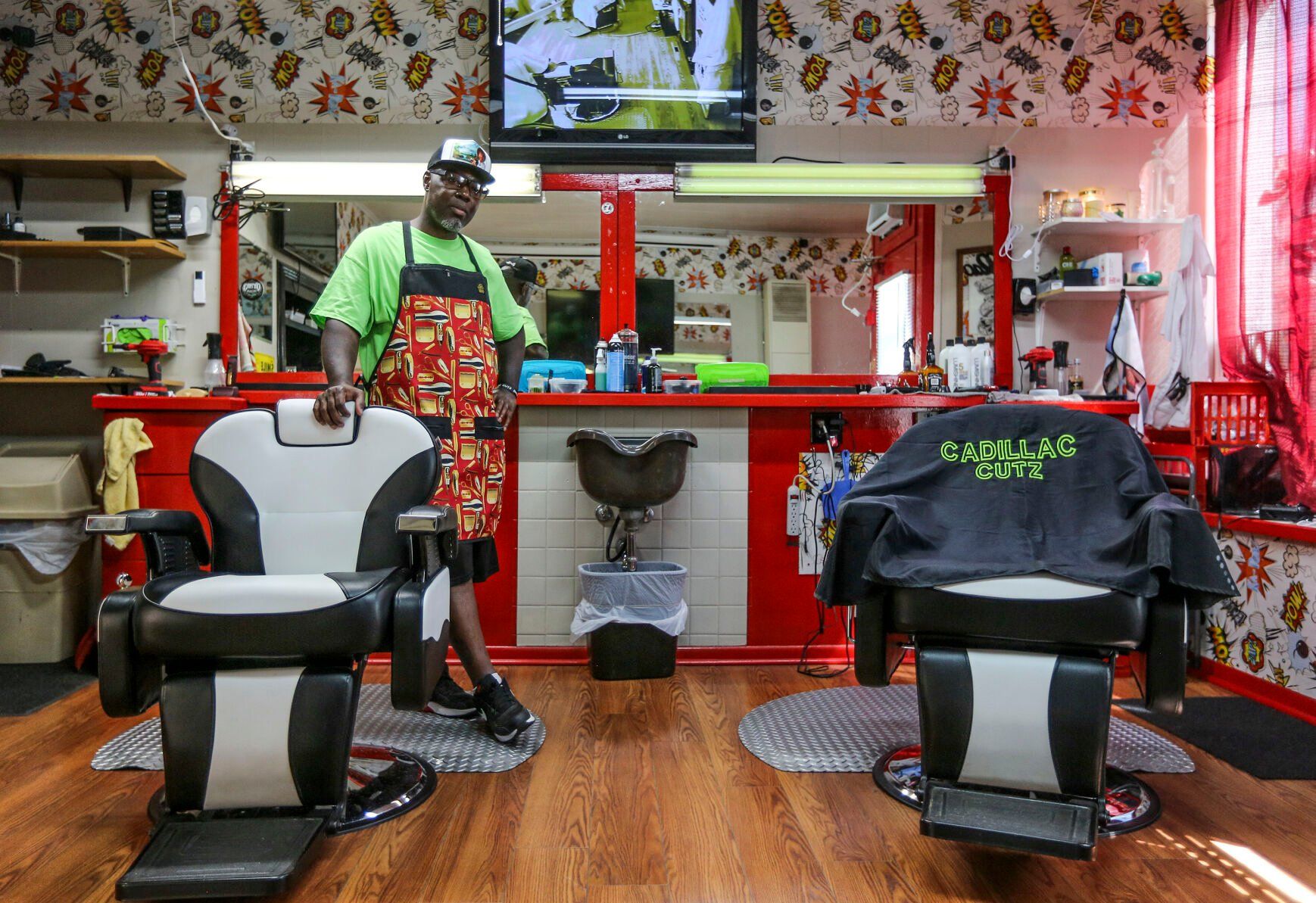 Makiah Cooper, owner of Cadillac Cutz on Elm Street in Dubuque, readies for a customer.    PHOTO CREDIT: Dave Kettering
Telegraph Herald