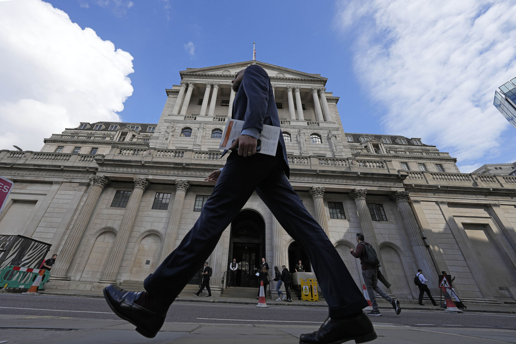 <p>FILE - A man walks past the Bank of England, at the financial district in London, on May 11, 2023. The Bank of England is poised to raise borrowing costs again on Thursday June 22, 2023, to combat stubbornly high inflation, which has failed to come down from its peak as quickly as expected. (AP Photo/Frank Augstein, File)</p>   PHOTO CREDIT: Frank Augstein