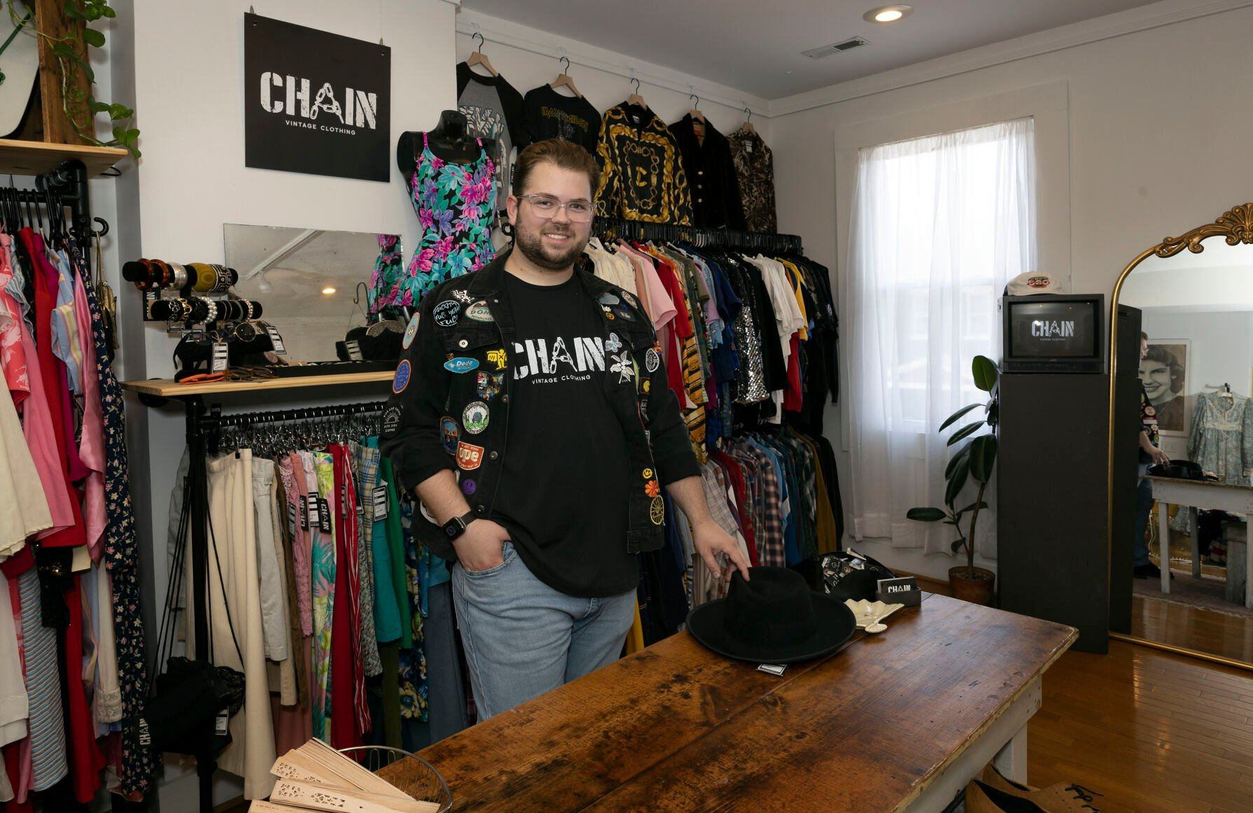 Owner Willie Tigges stands inside CHAIN Vintage Clothing on Bluff Street in Dubuque.    PHOTO CREDIT: Stephen Gassman