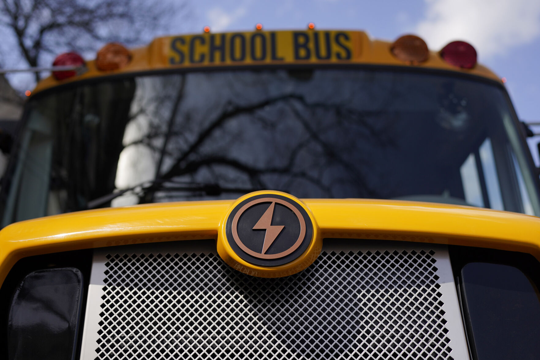 <p>FILE - A Lion electric school bus is seen on display in Austin, Texas, Feb. 22, 2023. The Transportation Department is awarding almost $1.7 billion in grants for buying zero and low emission buses, with the money going to transit projects in 46 states and territories. The grants will enable transit agencies and state and local governments to buy 1,700 U.S.-built buses, nearly half of which will have zero carbon emissions. (AP Photo/Eric Gay, File)</p>   PHOTO CREDIT: Eric Gay