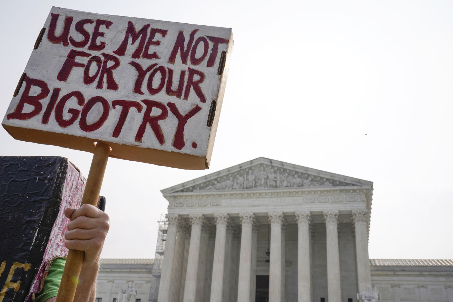 <p>A person protests outside the Supreme Court, Friday, June 30, 2023, as decisions are expected in Washington. (AP Photo/Mariam Zuhaib)</p>   PHOTO CREDIT: Mariam Zuhaib - staff, AP
