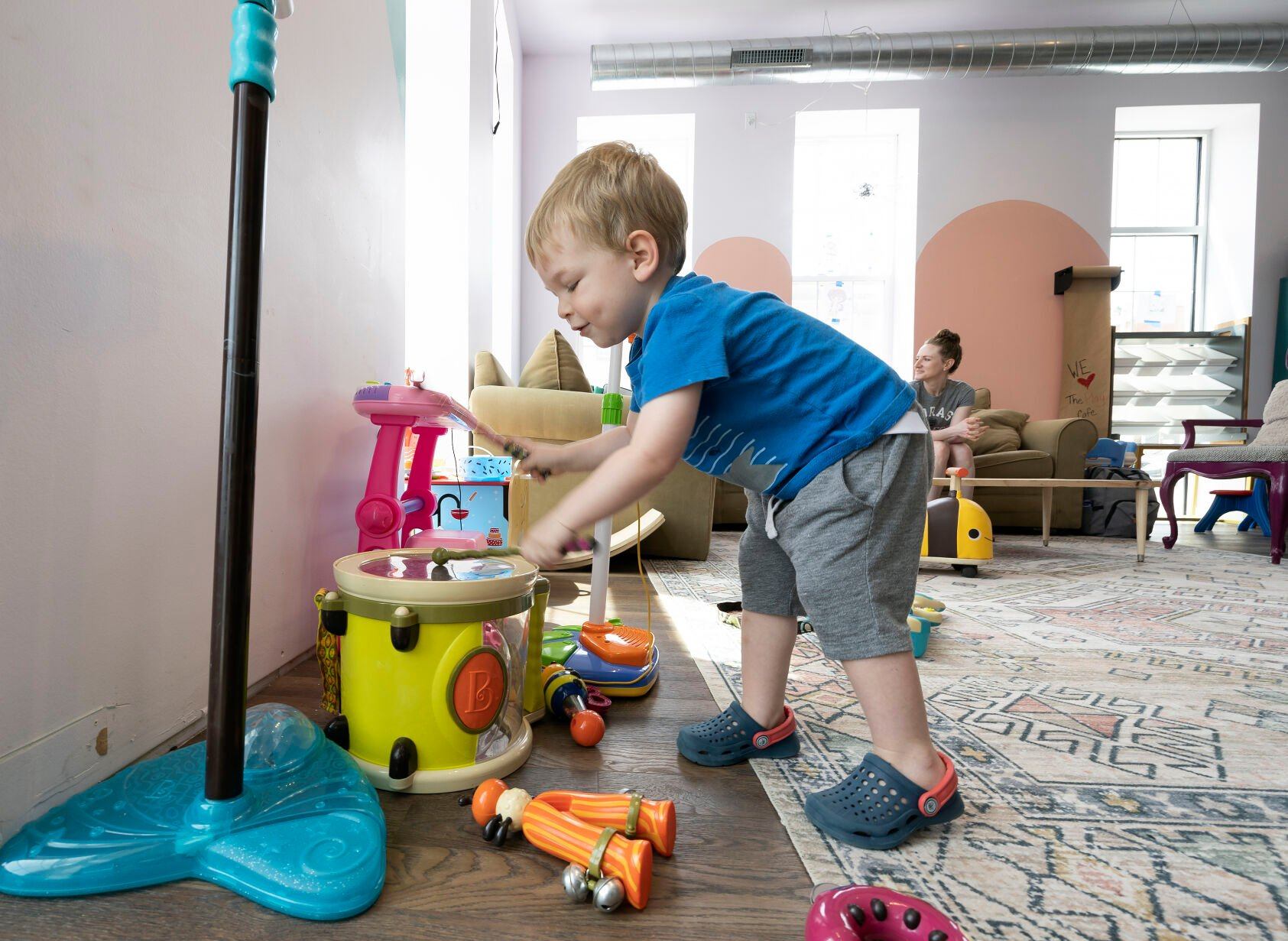 Benjamin Little, 2, plays drums at The Play Cafe in Dyersville, Iowa, on Friday.    PHOTO CREDIT: Stephen Gassman