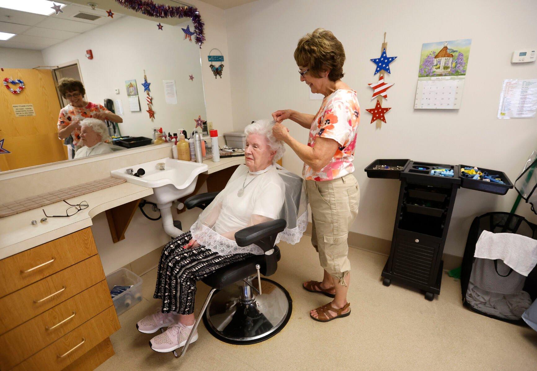 Donna Miller (left) has her hair done by Joyce Budde.    PHOTO CREDIT: JESSICA REILLY
Telegraph Herald
