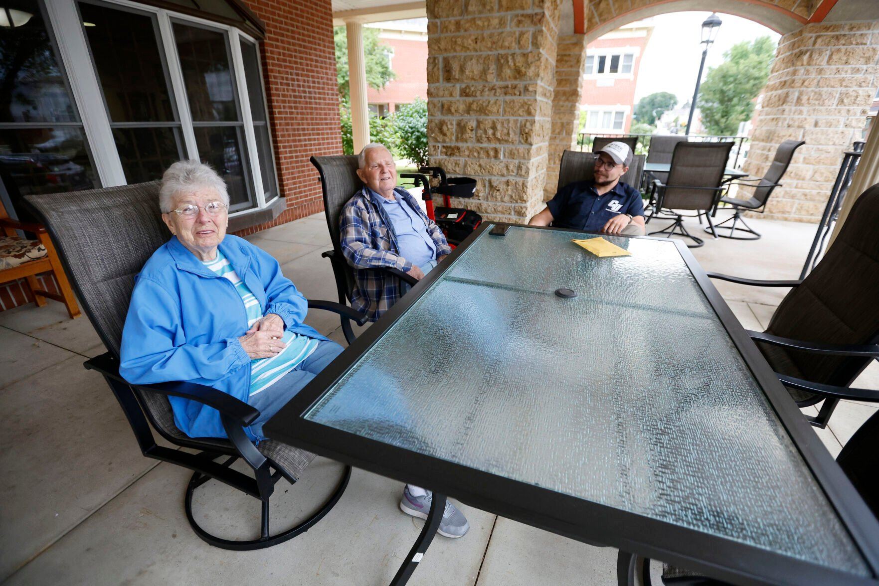 Mary Theisen (from left), Joe MacDonald and Ben MacDonald talk outside Bethany Home in Dubuque.    PHOTO CREDIT: JESSICA REILLY
Telegraph Herald