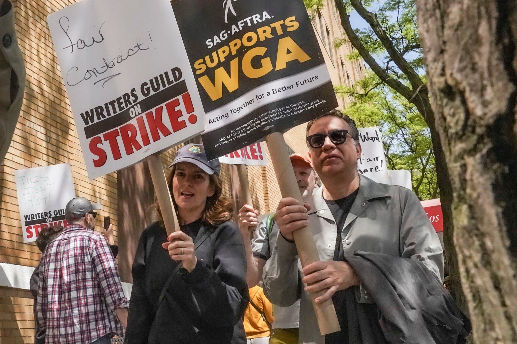 <p>FILE - Actors and comedians Tina Fey, center, and Fred Armisen, right, join striking members of the Writers Guild of America on the picket line during a rally outside Silvercup Studios, Tuesday May 9, 2023, in New York. Unionized Hollywood actors on the verge of a strike have agreed to allow a last-minute intervention from federal mediators but say they doubt a deal will be reached by a negotiation deadline late Wednesday, July 12, 2023. (AP Photo/Bebeto Matthews, File)</p>   PHOTO CREDIT: Bebeto Matthews 