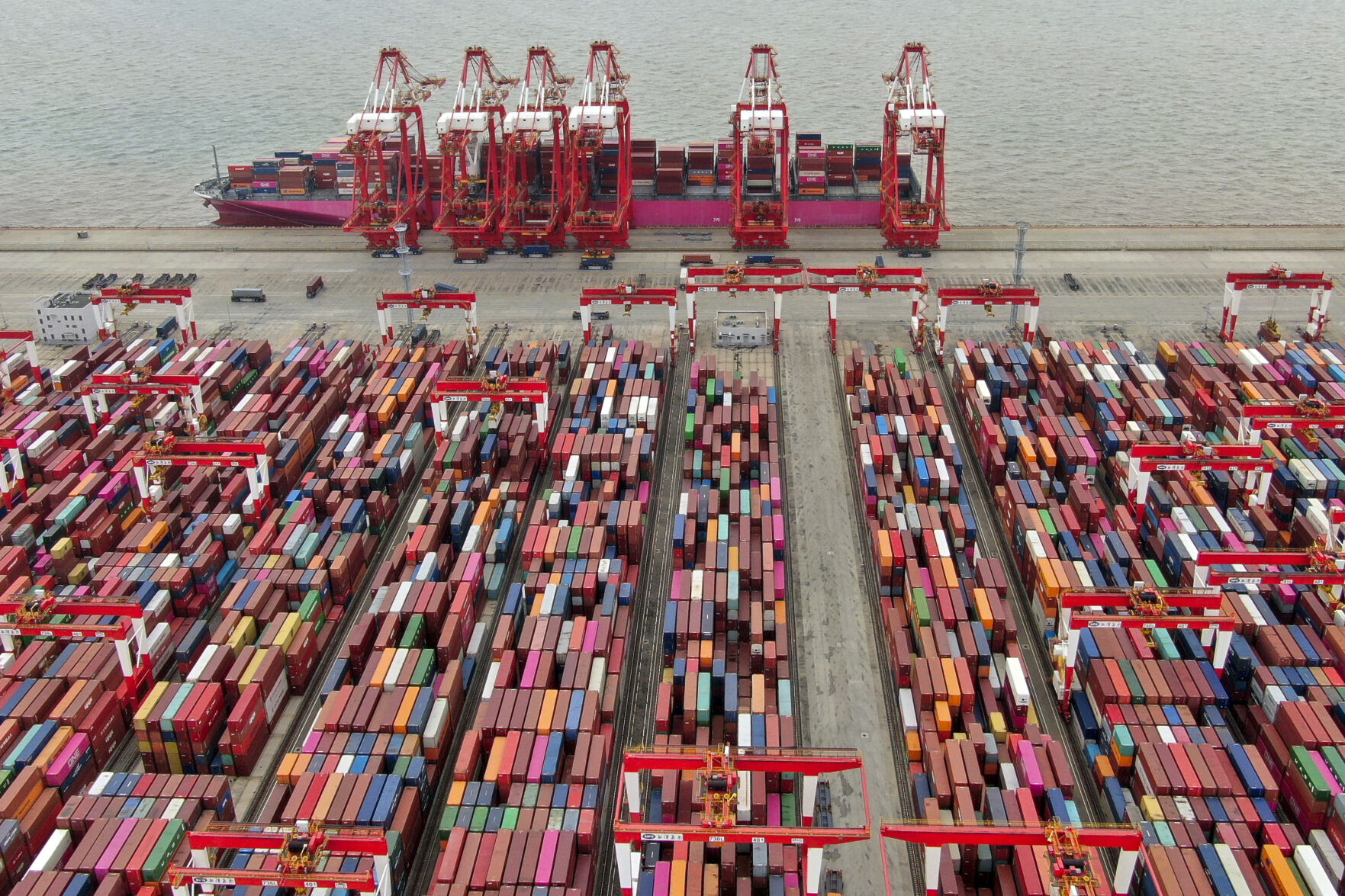 <p>FILE - The Yangshan container port is seen in an aerial view in Shanghai, China on July 10, 2021. China’s exports tumbled in June, 2023, by 12.4% compared with a year earlier amid weaker global demand and higher inflation. (Chinatopix via AP, File)</p>   PHOTO CREDIT: CHINATOPIX