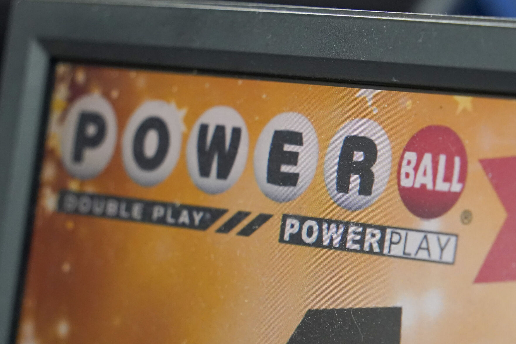 <p>FILE - A display panel advertises tickets for a Powerball drawing at a convenience store, Nov. 7, 2022, in Renfrew, Pa. The Powerball jackpot soared to an estimated $875 million after no winning ticket was sold for the Wednesday, July 12, 2023, drawing. (AP Photo/Keith Srakocic, File)</p>   PHOTO CREDIT: Keith Srakocic