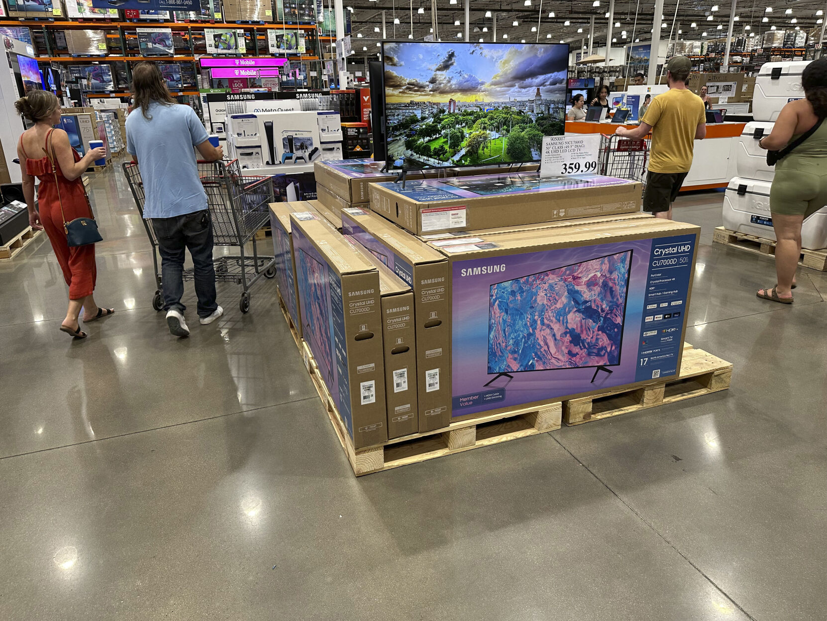 <p>Shoppers glide past a display of big-screen televisions in a Costco warehouse on Tuesday, July 11, 2023, in Sheridan, Colo. On Tuesday, July 18, the Commerce Department releases U.S. retail sales data for June. (AP Photo/David Zalubowski)</p>   PHOTO CREDIT: David Zalubowski 