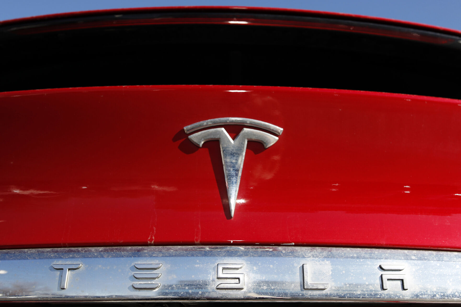 <p>FILE - The Tesla company logo is shown at a Tesla dealership in Littleton, Colo. Feb. 2, 2020. Tesla said in its safety recall report that is recalling nearly 16,000 of its 2021-2023 Model S and Model X vehicles because some front-row seat belts may not have been reconnected properly following a repair. (AP Photo/David Zalubowski, File)</p>   PHOTO CREDIT: David Zalubowski 