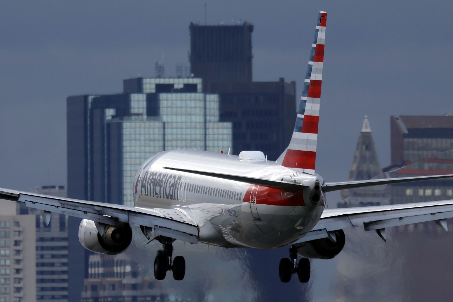 <p>File - An American Airlines plane lands at Logan International Airport, Thursday, Jan. 26, 2023, in Boston. American Airlines earnings are reported on Thursday. (AP Photo/Michael Dwyer, File)</p>   PHOTO CREDIT: Michael Dwyer