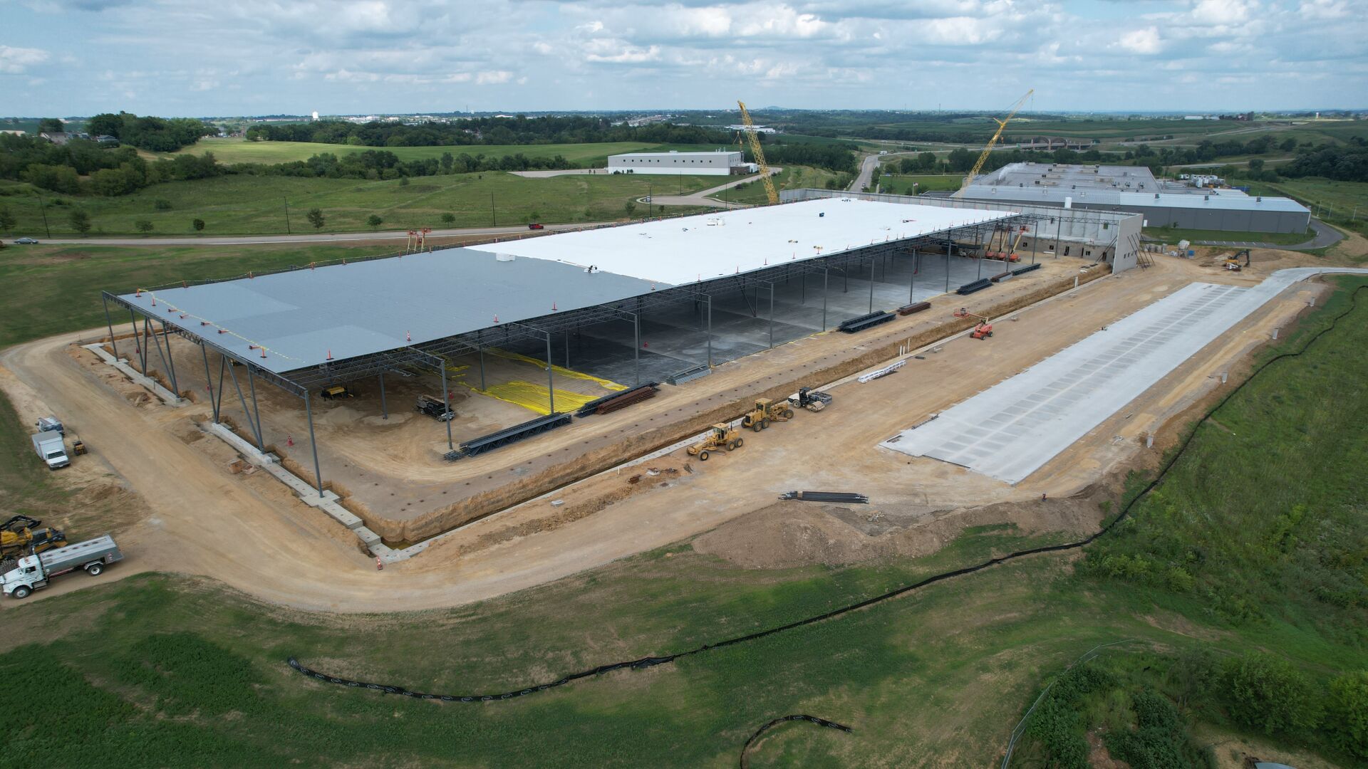 Work continues on a new warehouse along Seippel Road in Dubuque on Thursday, July 20, 2023. Seippel Warehouse LLC is constructing the 250,000-square-foot warehouse, which it will lease to Simmons Pet Food once it is completed.    PHOTO CREDIT: Dave Kettering