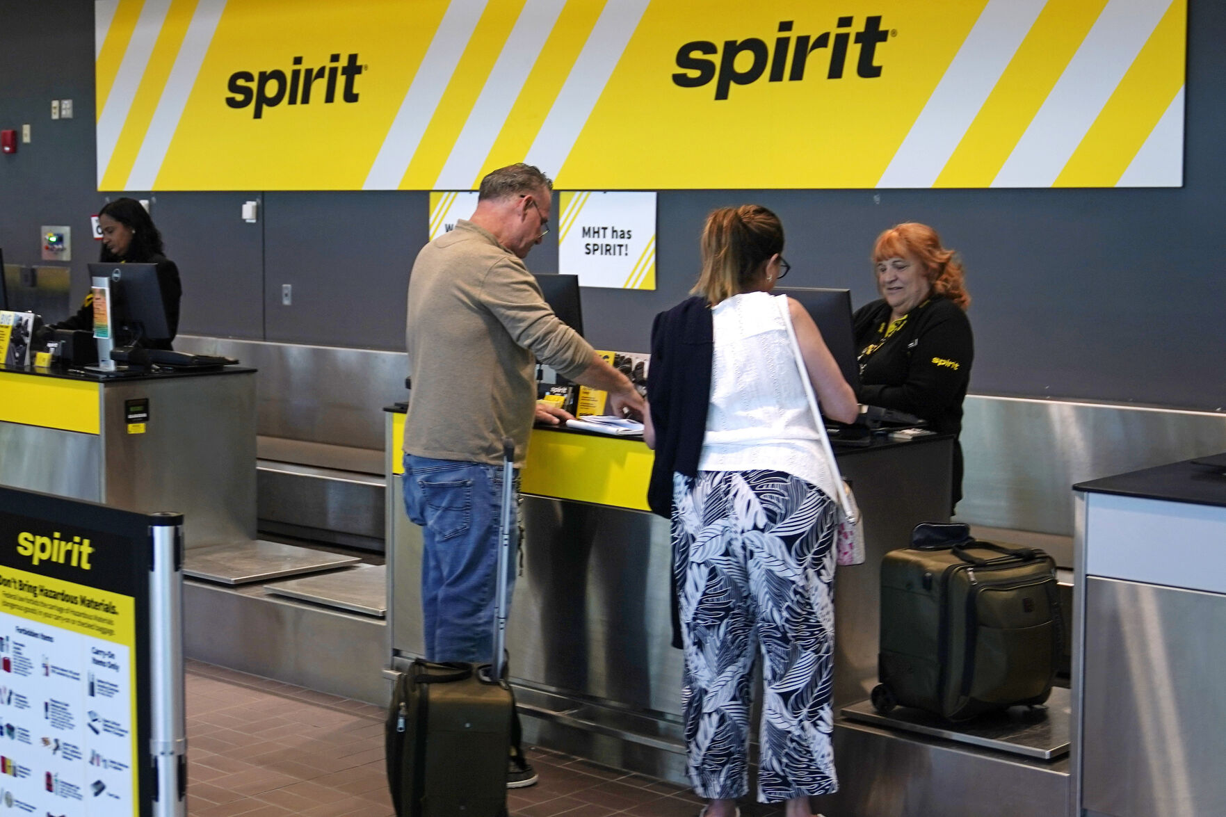 <p>Travelers check in at the Spirit Airlines ticket counter at Manchester Boston Regional Airport, Friday, June 2, 2023, in Manchester, N.H. On Tuesday, the Conference Board reports on U.S. consumer confidence for July. (AP Photo/Charles Krupa)</p>   PHOTO CREDIT: Charles Krupa 