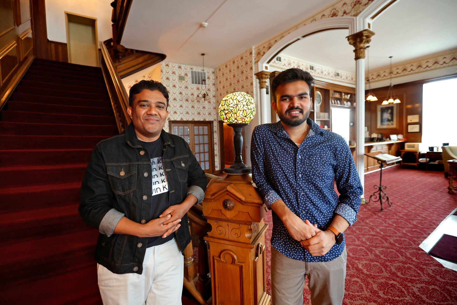 Owner Mihar "Mike" Patel (left) and his business partner Maher Patel stand at the Decker House Hotel in Maquoketa, Iowa, on Wednesday, July 26, 2023.    PHOTO CREDIT: JESSICA REILLY