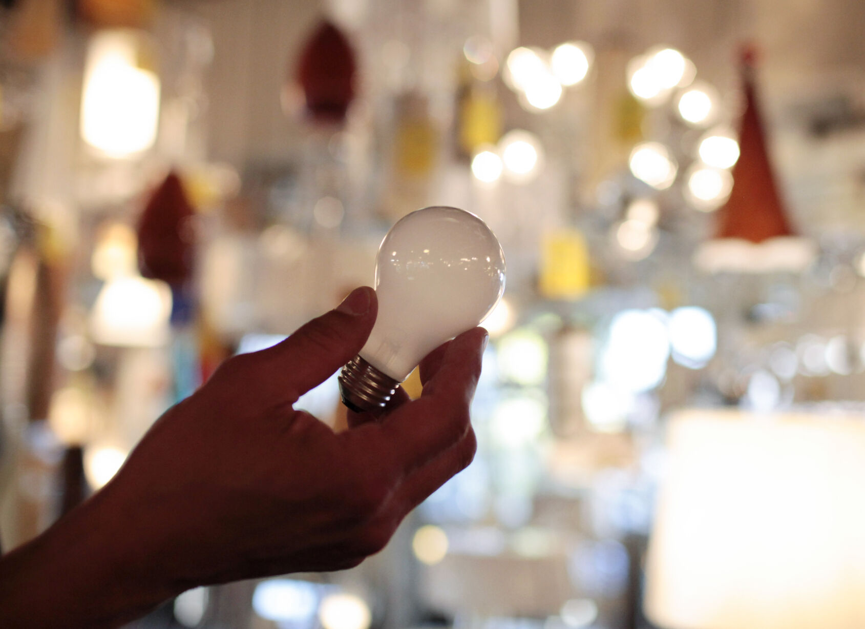 <p>FILE - Manager Nick Reynoza holds a 100-watt incandescent light bulb at Royal Lighting in Los Angeles, Jan. 21, 2011. New federal rules governing the energy efficiency of lighting systems went into full effect Tuesday, effectively ending the sale and manufacture of bulbs that trace their origin to an 1880 Thomas Edison patent. (AP Photo/Jae C. Hong, File)</p>   PHOTO CREDIT: Jae C. Hong