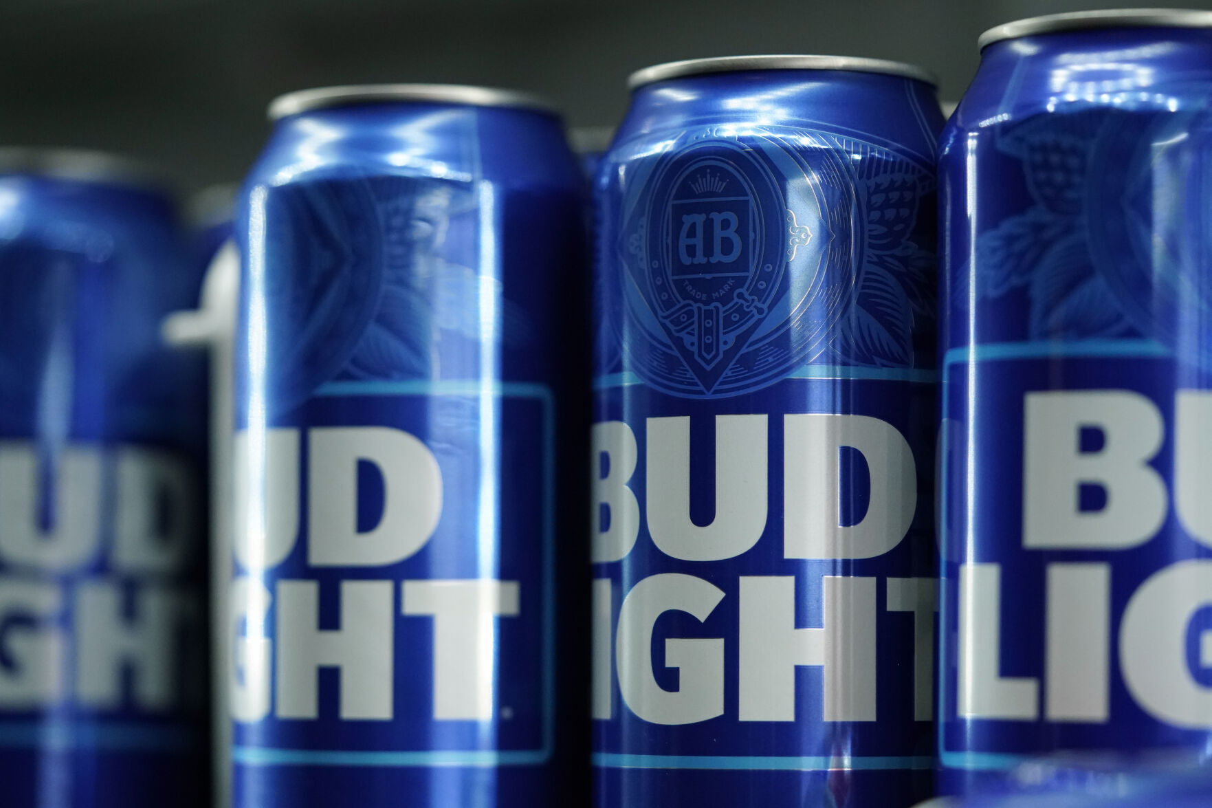 <p>FILE - Cans of Bud Light beer are seen before a baseball game between the Philadelphia Phillies and the Seattle Mariners on April 25, 2023, in Philadelphia. Anheuser-Busch InBev has reported a drop in U.S. revenue in the second quarter as Bud Light sales plunged amid conservative backlash over a campaign with transgender influencer Dylan Mulvaney. (AP Photo/Matt Slocum, File)</p>   PHOTO CREDIT: Matt Slocum 