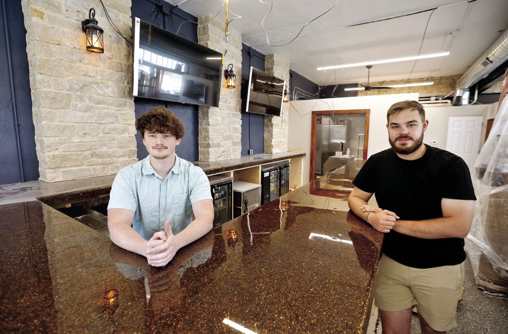 Owners Patrick Kelly (left) and Payton Marshall plan to open their new bar, Prost, in Bellevue, Iowa, on Saturday, Aug. 12. Grand opening festivities will include food trucks and live music at the bar.    PHOTO CREDIT: JESSICA REILLY