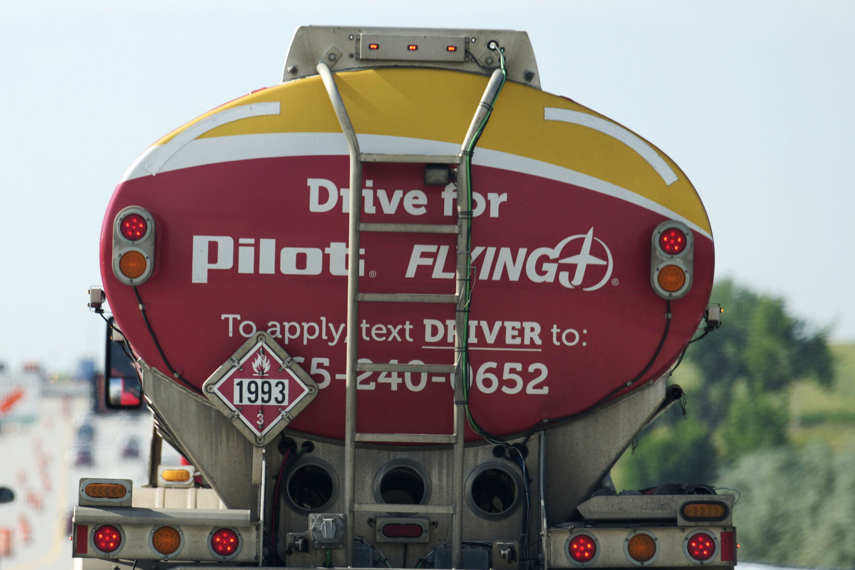 <p>A sign advertising for new drivers adorns the back of a tanker carrying fuel in the southbound lanes of Interstate 25 Tuesday, Aug. 8, 2023, in Loveland, Colo. On Thursday, the Labor Department reports on the number of people who applied for unemployment benefits last week. (AP Photo/David Zalubowski)</p>   PHOTO CREDIT: David Zalubowski 