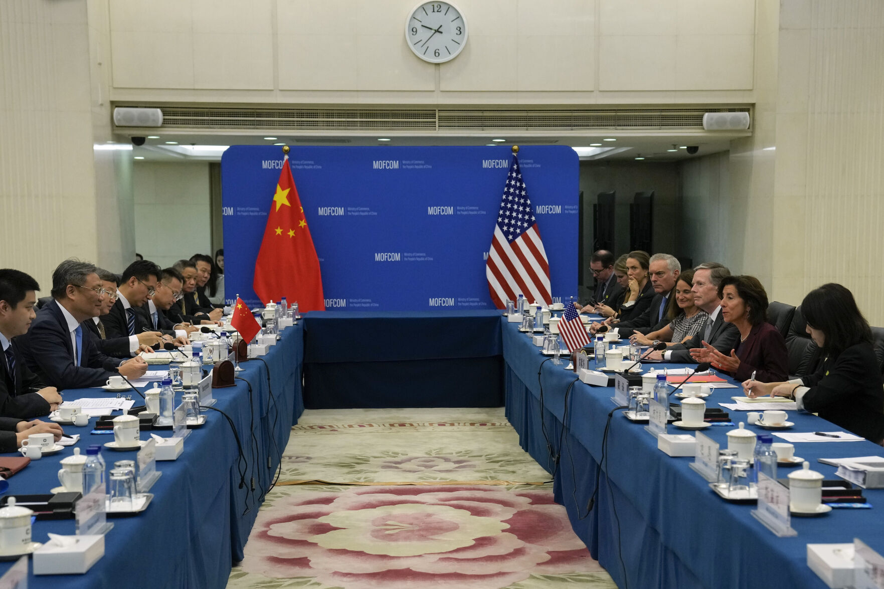 <p>U.S. Commerce Secretary Gina Raimondo, second right, speaks during a meeting with Chinese Minister of Commerce Wang Wentao, second left, at the Ministry of Commerce in Beijing, Monday, Aug. 28, 2023. (AP Photo/Andy Wong, Pool)</p>   PHOTO CREDIT: Andy Wong 