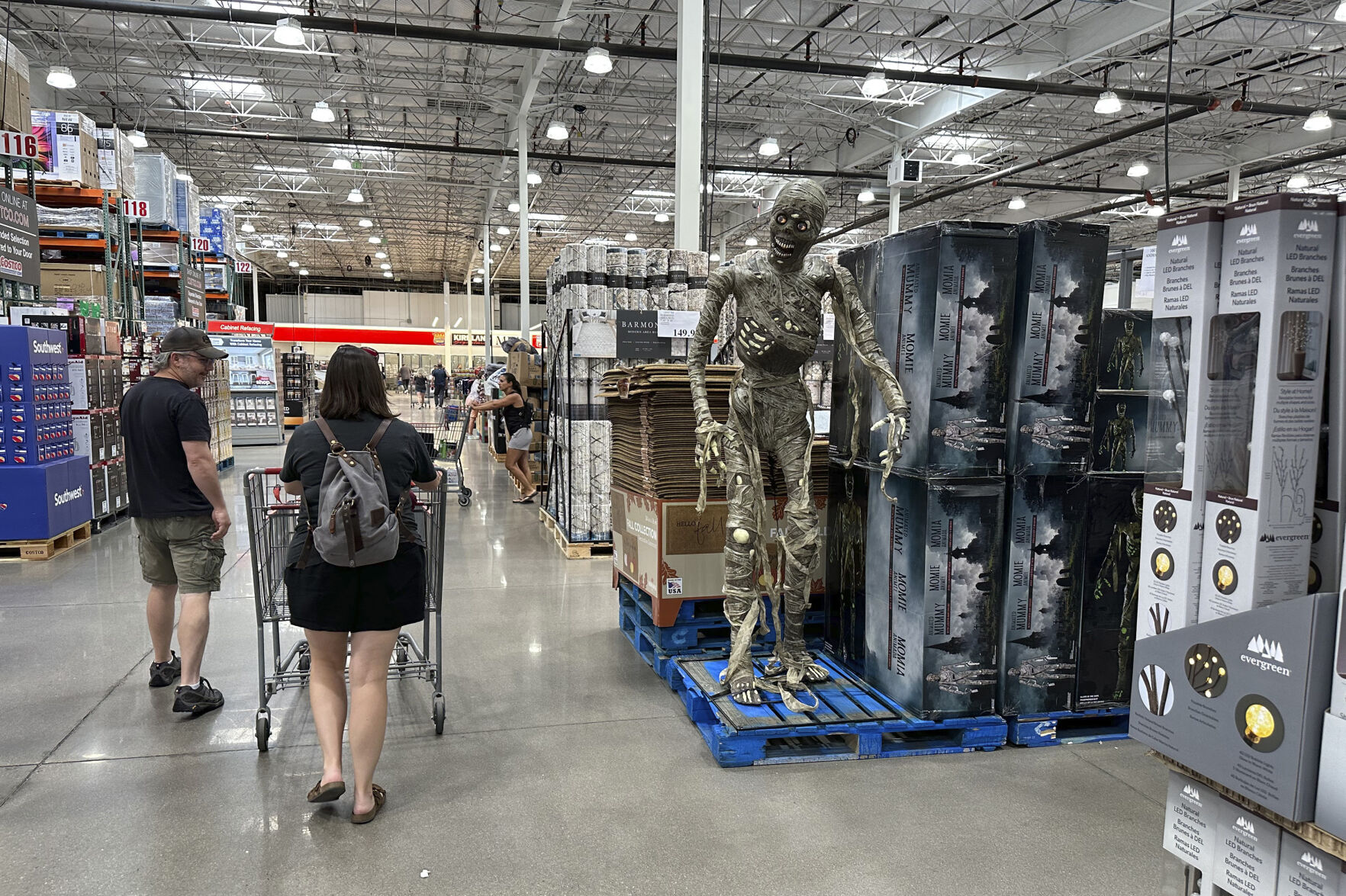 <p>Shoppers pass a display of Halloween goods in a Costco warehouse Friday, Aug. 4, 2023, in Thornton, Colo. On Thursday, the Commerce Department issues its July report on consumer spending. (AP Photo/David Zalubowski)</p>   PHOTO CREDIT: David Zalubowski 
