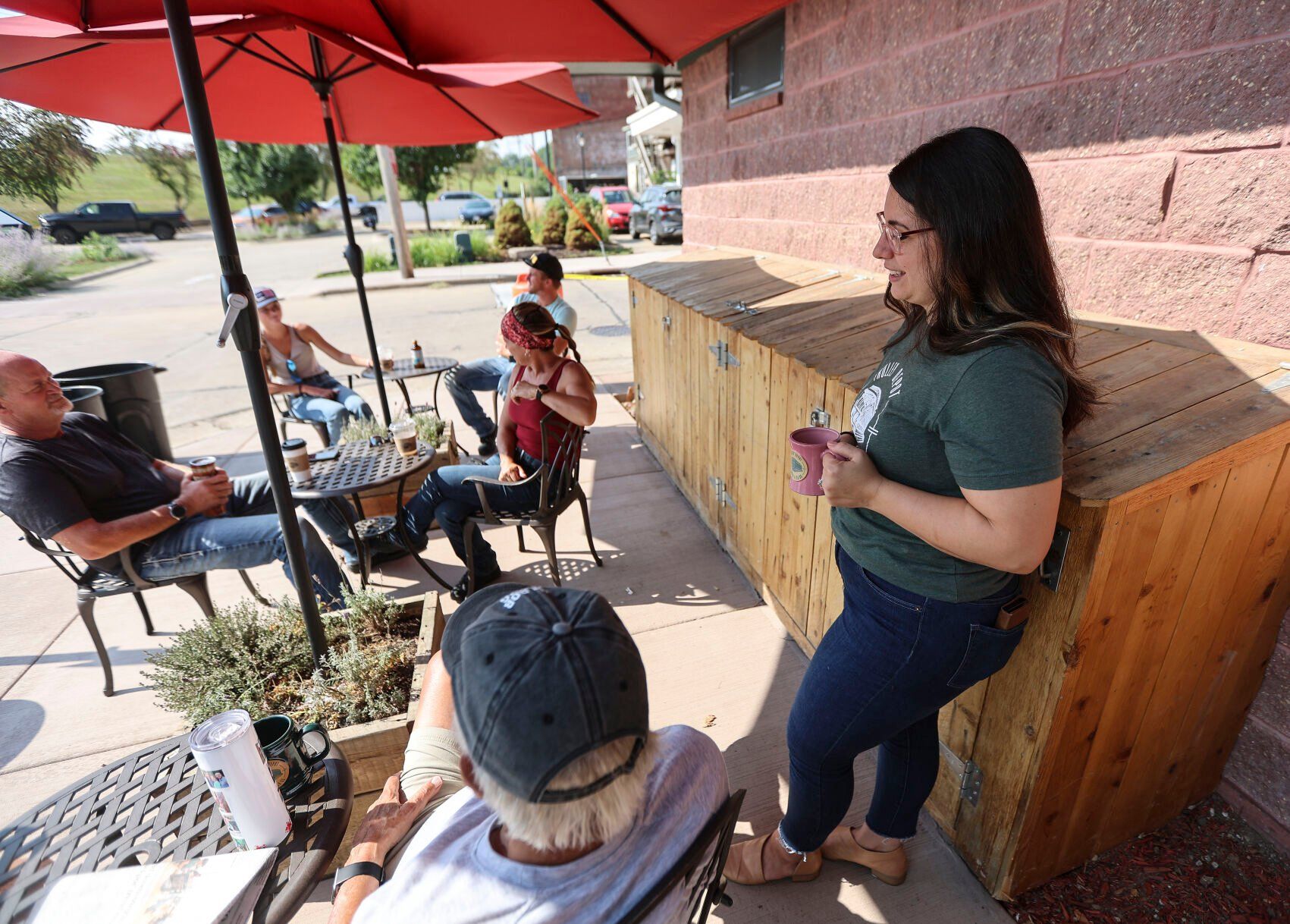 Joy Heller, co-owner of Trolley Depot Coffee & Tea Co. in Galena, Ill., chats with customers on Tuesday.    PHOTO CREDIT: Dave Kettering